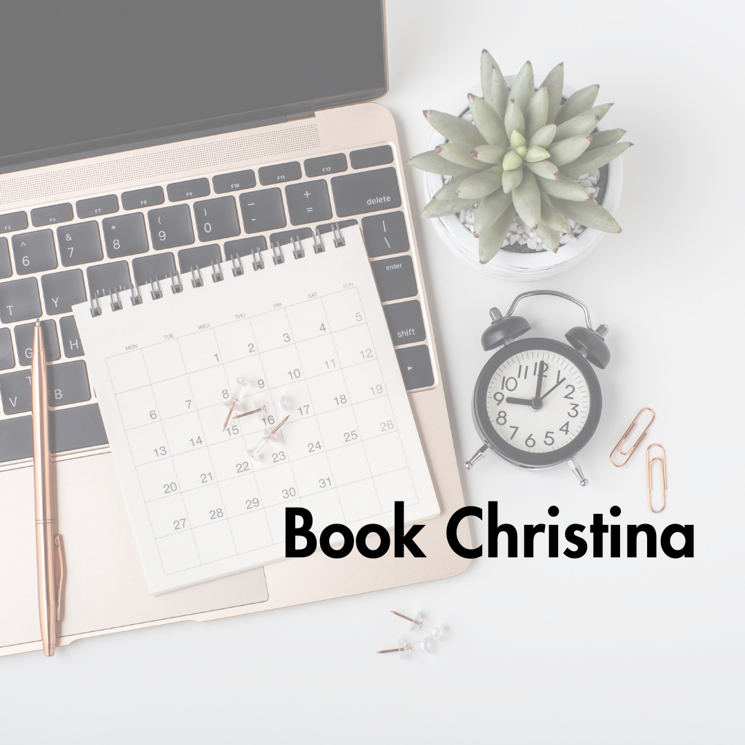 Laptop keyboard with planner, thumbtacks, clock, succulent plant, and paper clips on white desk. Text 'Book Christing' overlaid.