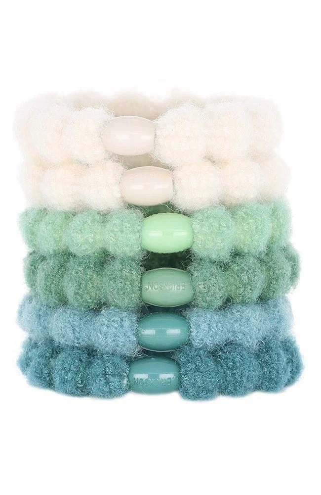 set of 6 hair ties with colors ranging from white to green to blue.