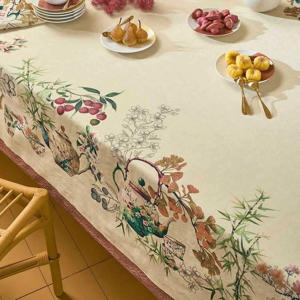 table with food atop the Theieres Rouille Tablecloth.