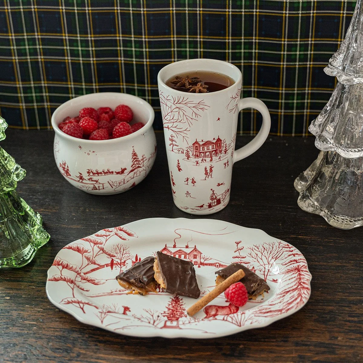 Travel mug holding beverage on table with other pieces.