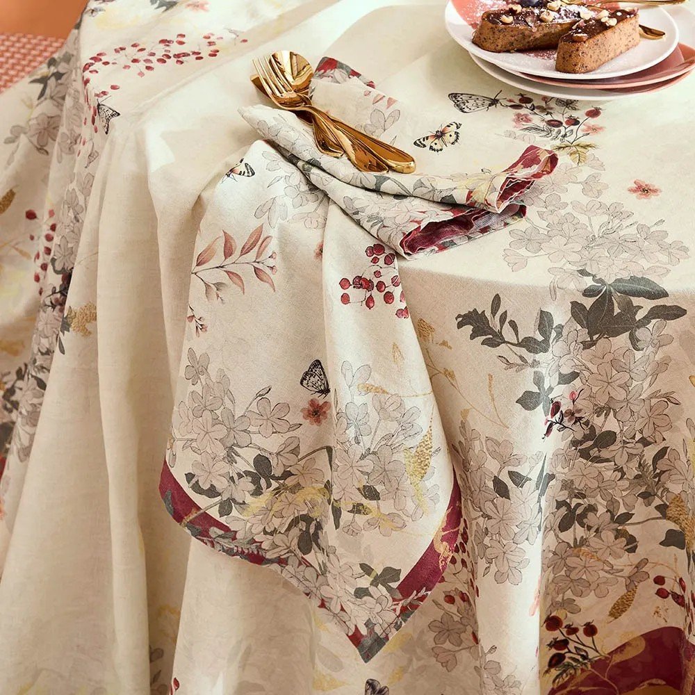 Cream vintage inspired napkin with cranberry toned accents.