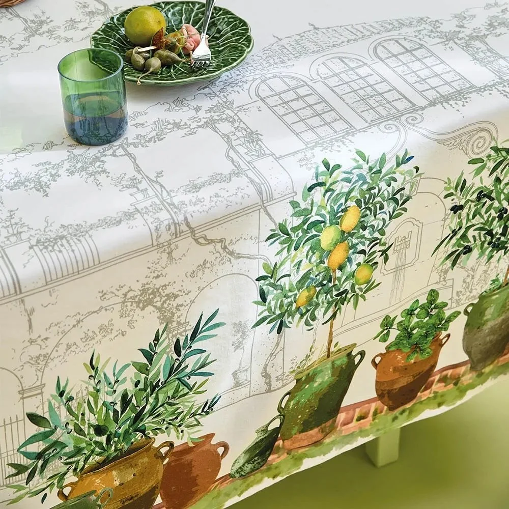 Jardin Provencal Olive Tablecloth laying on table.