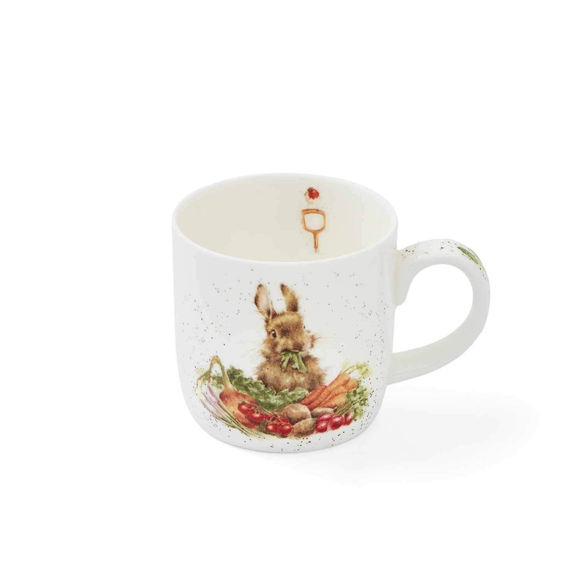 White mug with watercolor like bunny eating fresh vegetables and robin on the inside.