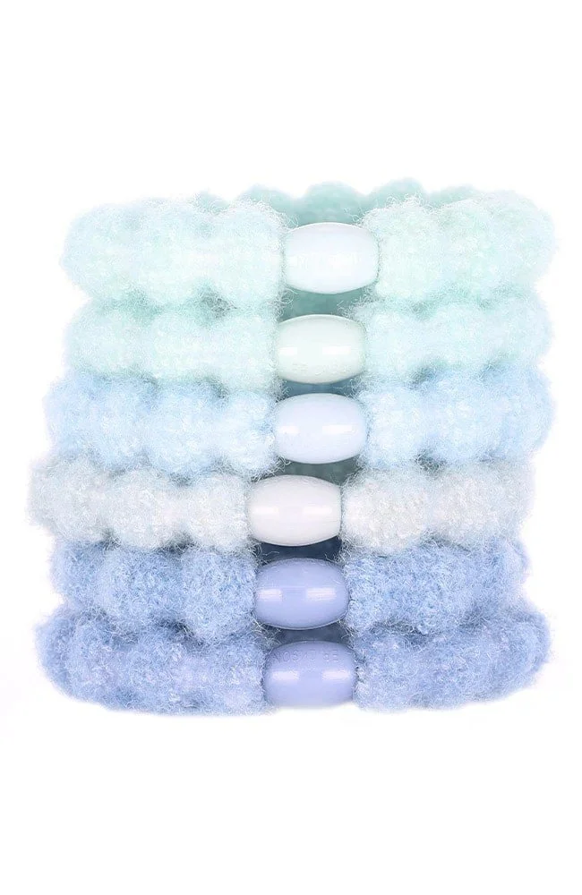 set of 6 hair ties in a variety of blue colors.