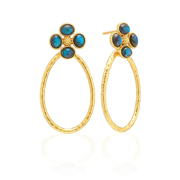 Hammered gold teardrop shaped hoop earrings hanging from blue labradorite clover posts.