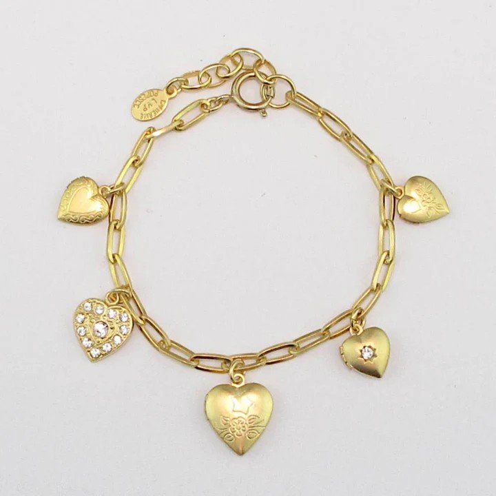 gold bracelet with 4 heart charm lockets, and one heart charm.