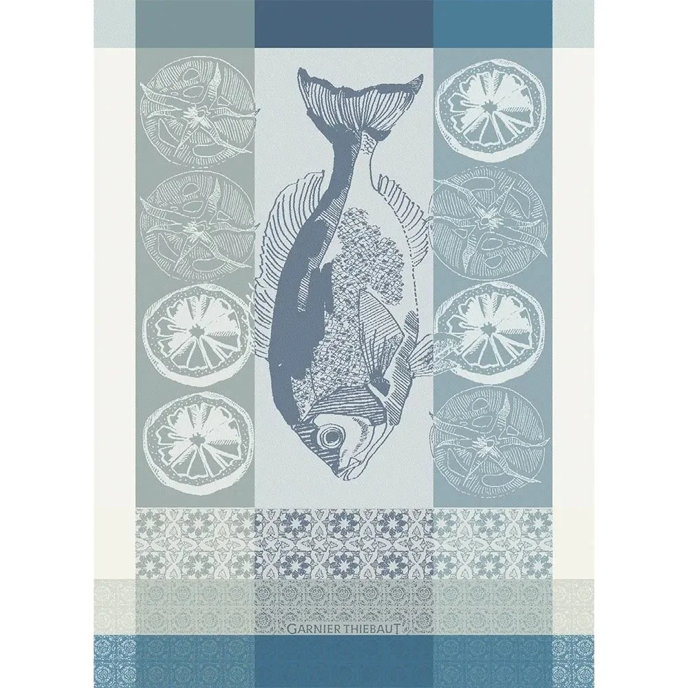 blue-toned kitchen towel with fish and citrus slices.