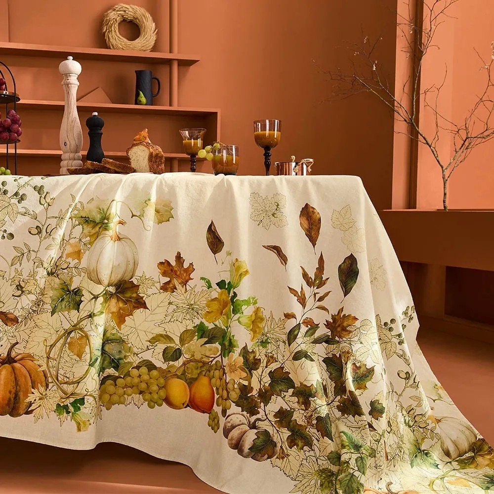 Cream vintage linen tablecloth with pumpkins, vines and fruits.