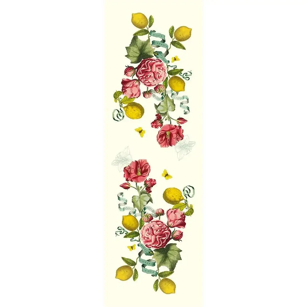 Table runner with pink florals, lemons and greenery.
