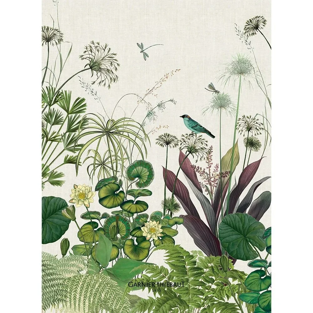 kitchen towel with variety of plants, birds and dragonflies in mostly green and cream.