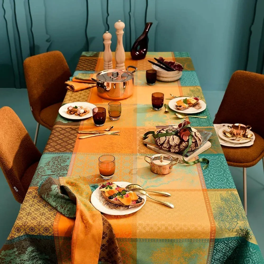 set table with fall looking blue yellow and brown tablecloth
