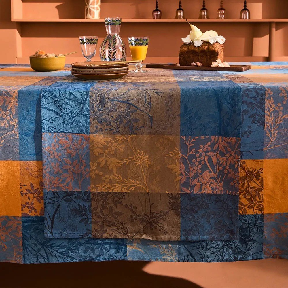 blue and yellow jacquard tablerunner on matching tablecloth
