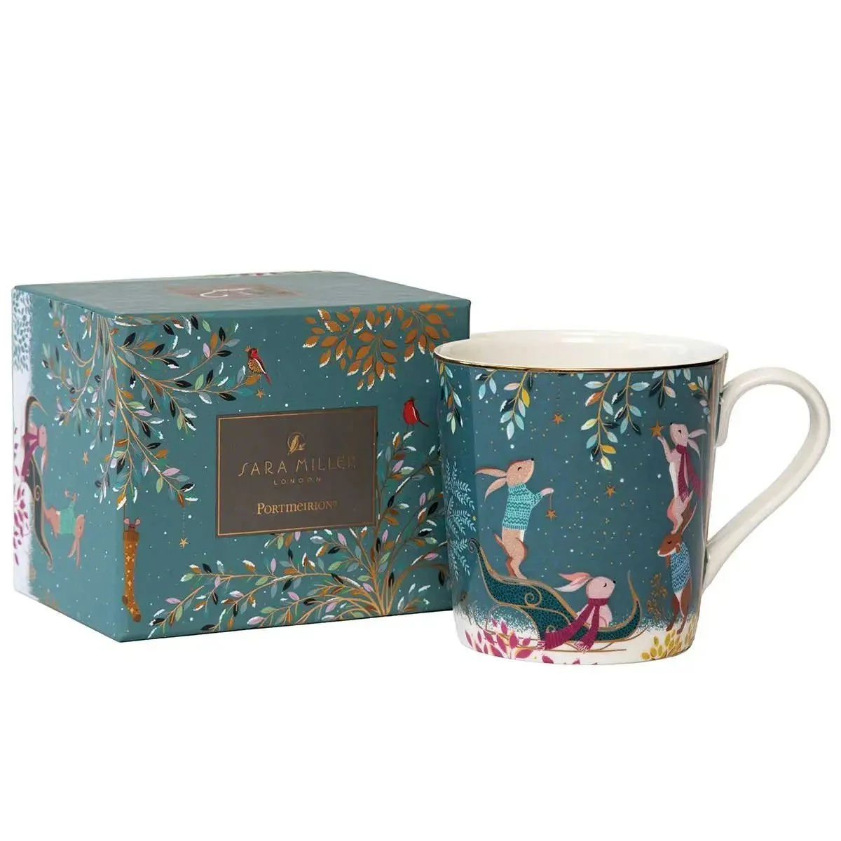 deep teal mug with rabbits in a sleigh hanging ornaments.