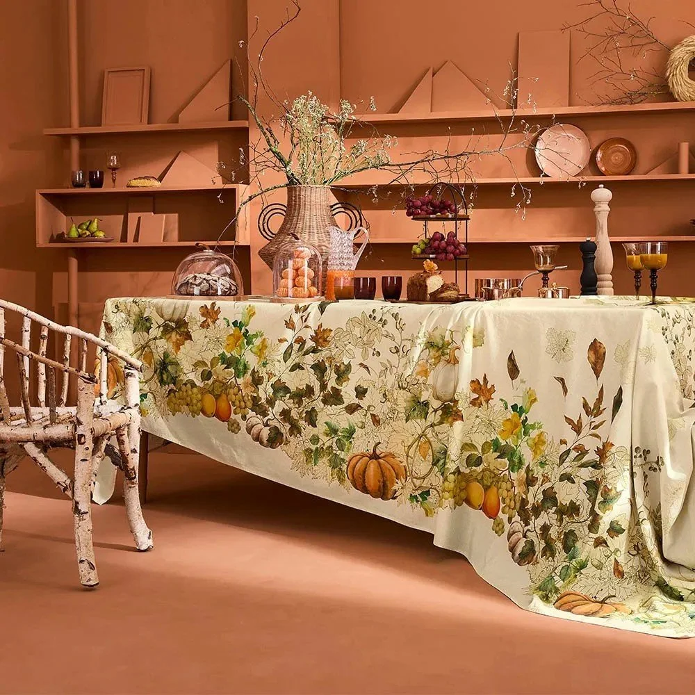 vintage inspired tablecloth featuring pumpkins, fruit and vines.