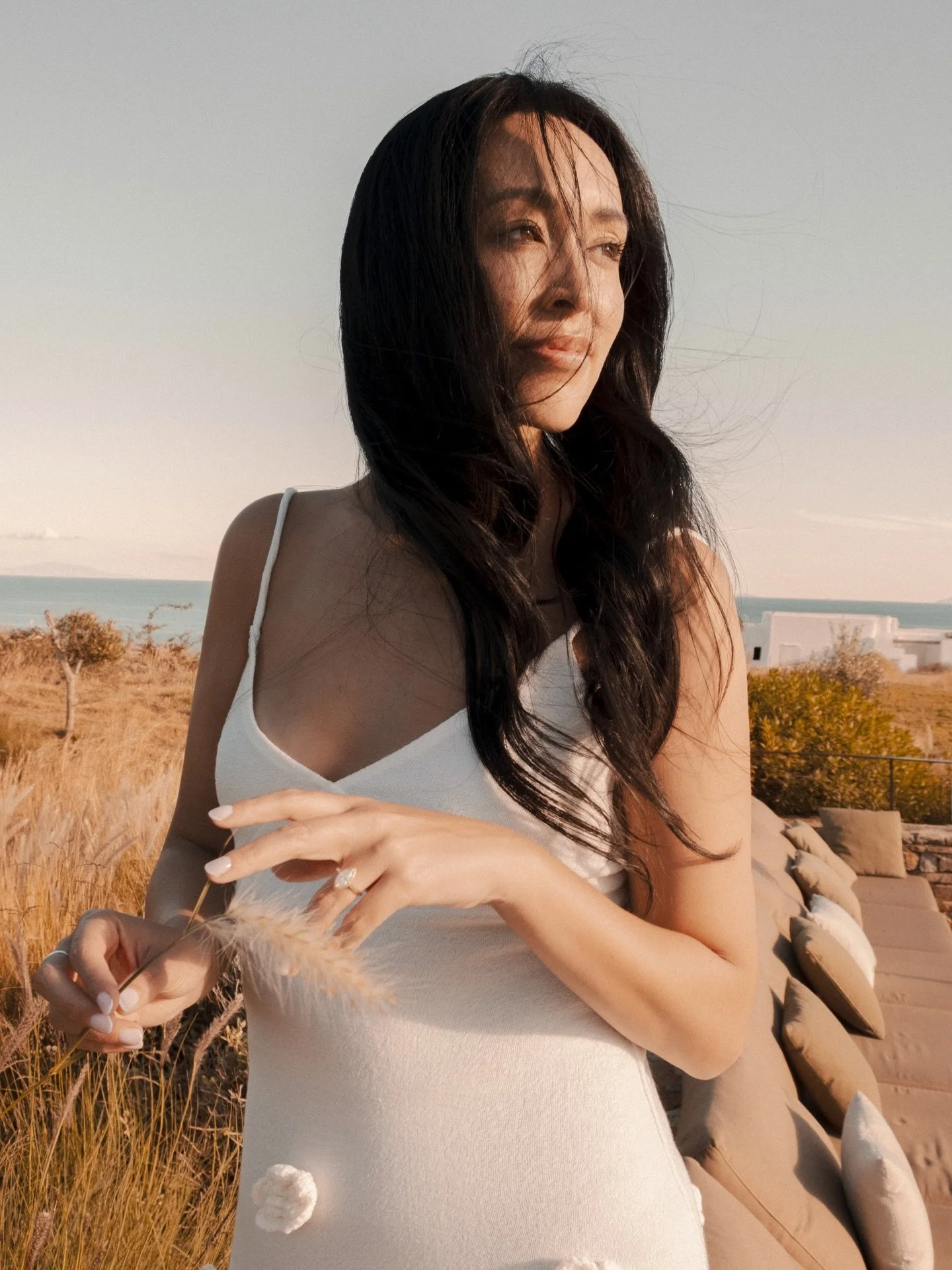 Greek summer nostalgia. Salt on your skin, hair tousled by the soft wind. The quiet calm before the vows, the gentle pause before the celebration. And your photographer there, preserving the raw emotion of the day before forever.