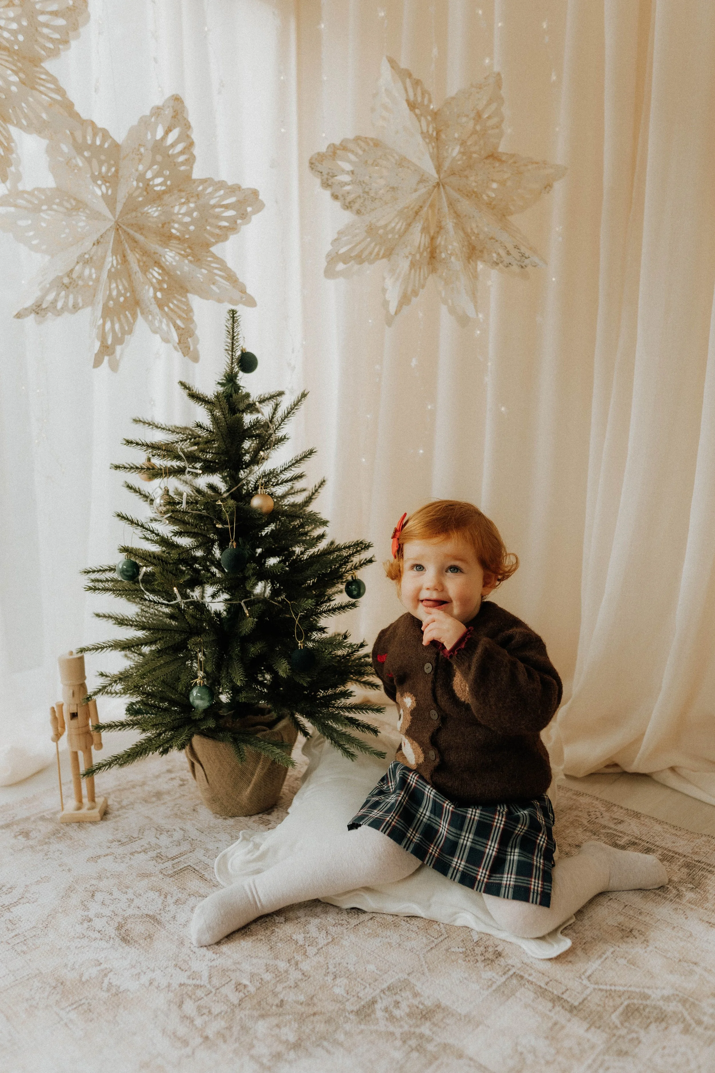 Image of a young girl on her Christmas Shoot with Didsbury Family Photographer at her West Didsbury photography studio