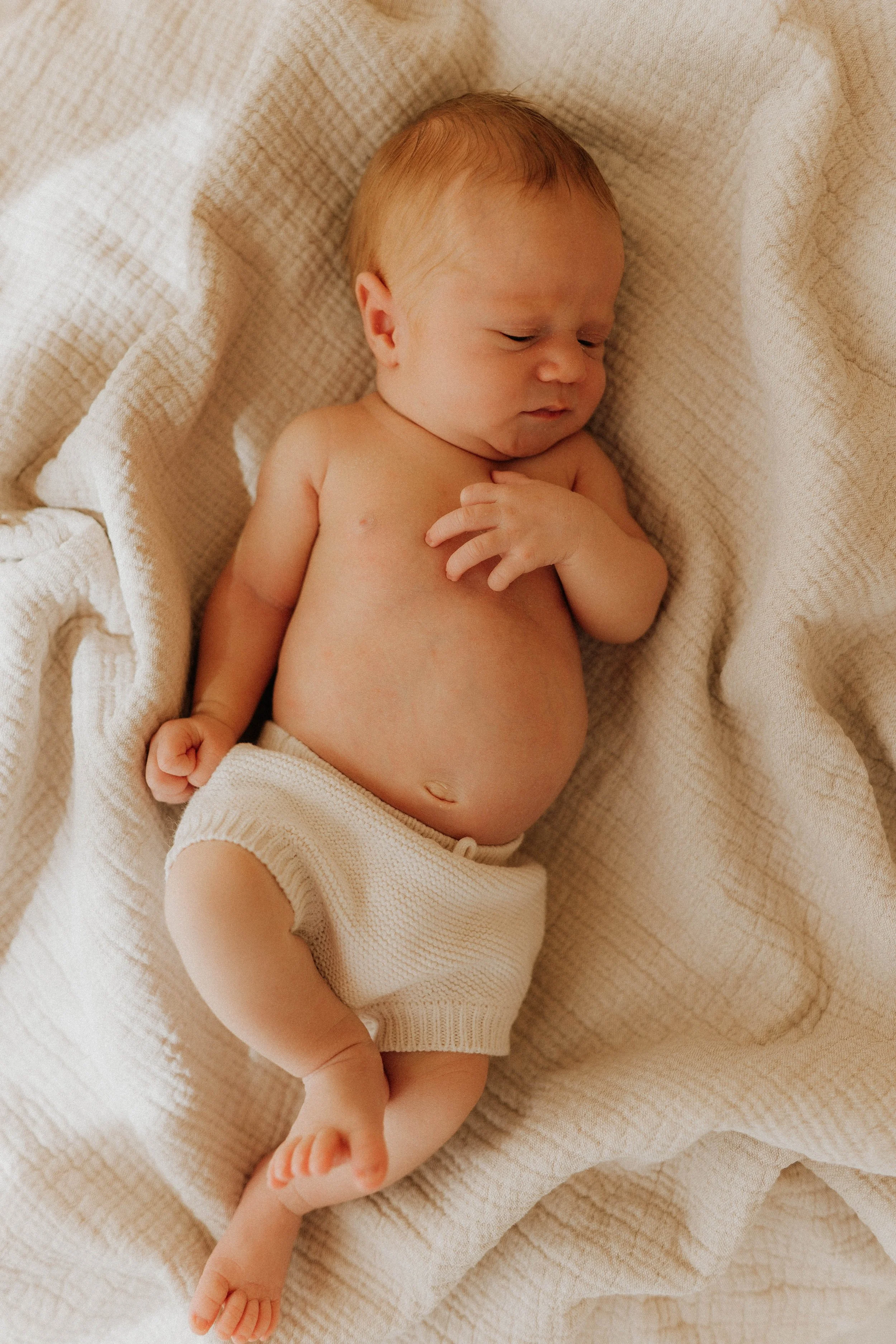image of a newborn baby at their newborn shoot at Didsbury Photography Studio