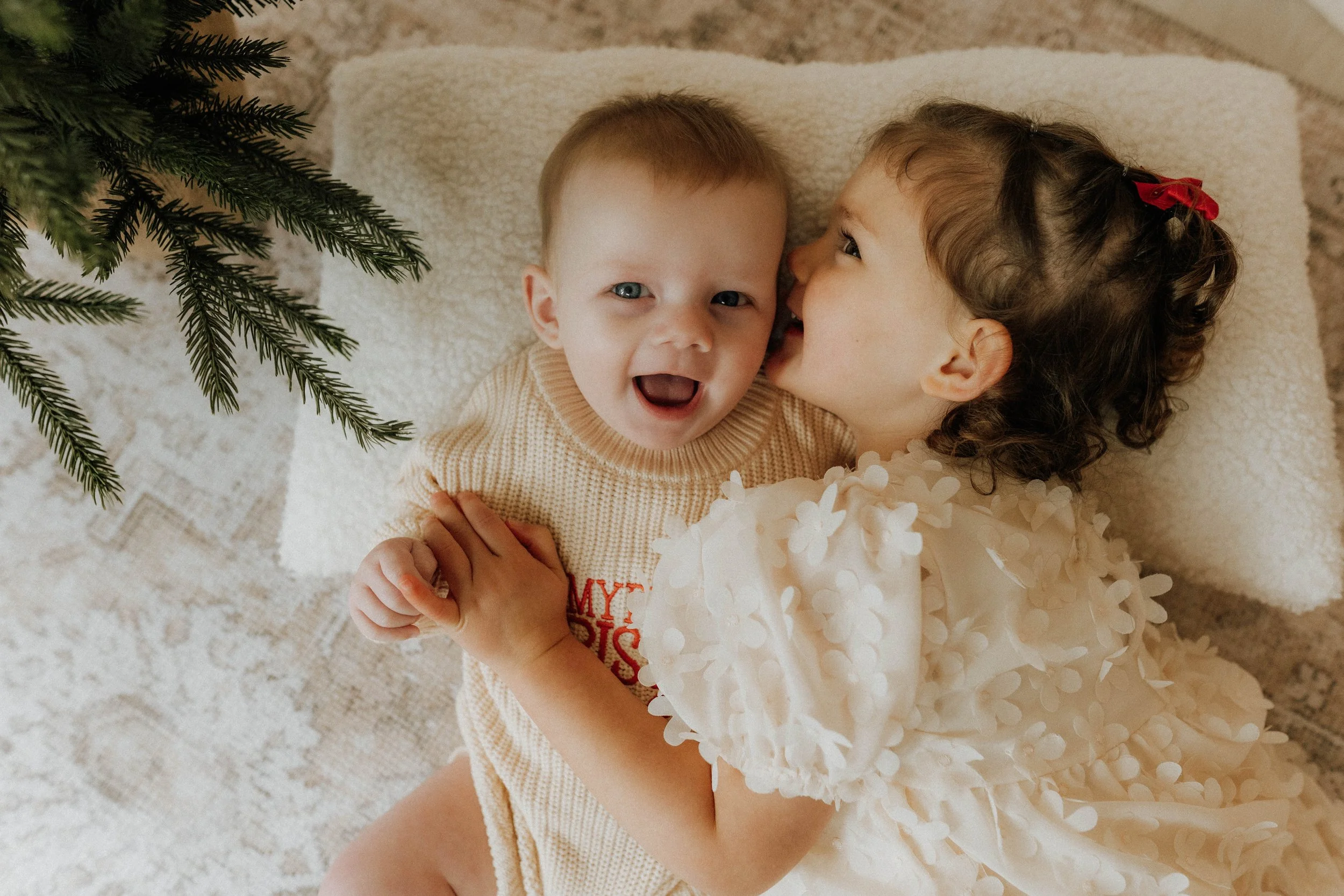 Image of a baby boy and his big sister on their Christmas shoot on their Christmas shoot in Didsbury