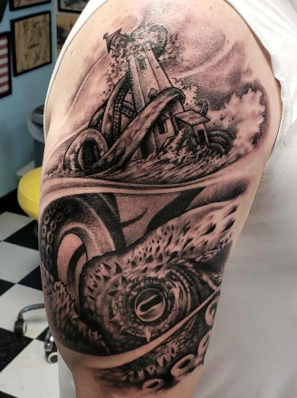 Black and grey tattoo of a lighthouse with waves crashing at the base.