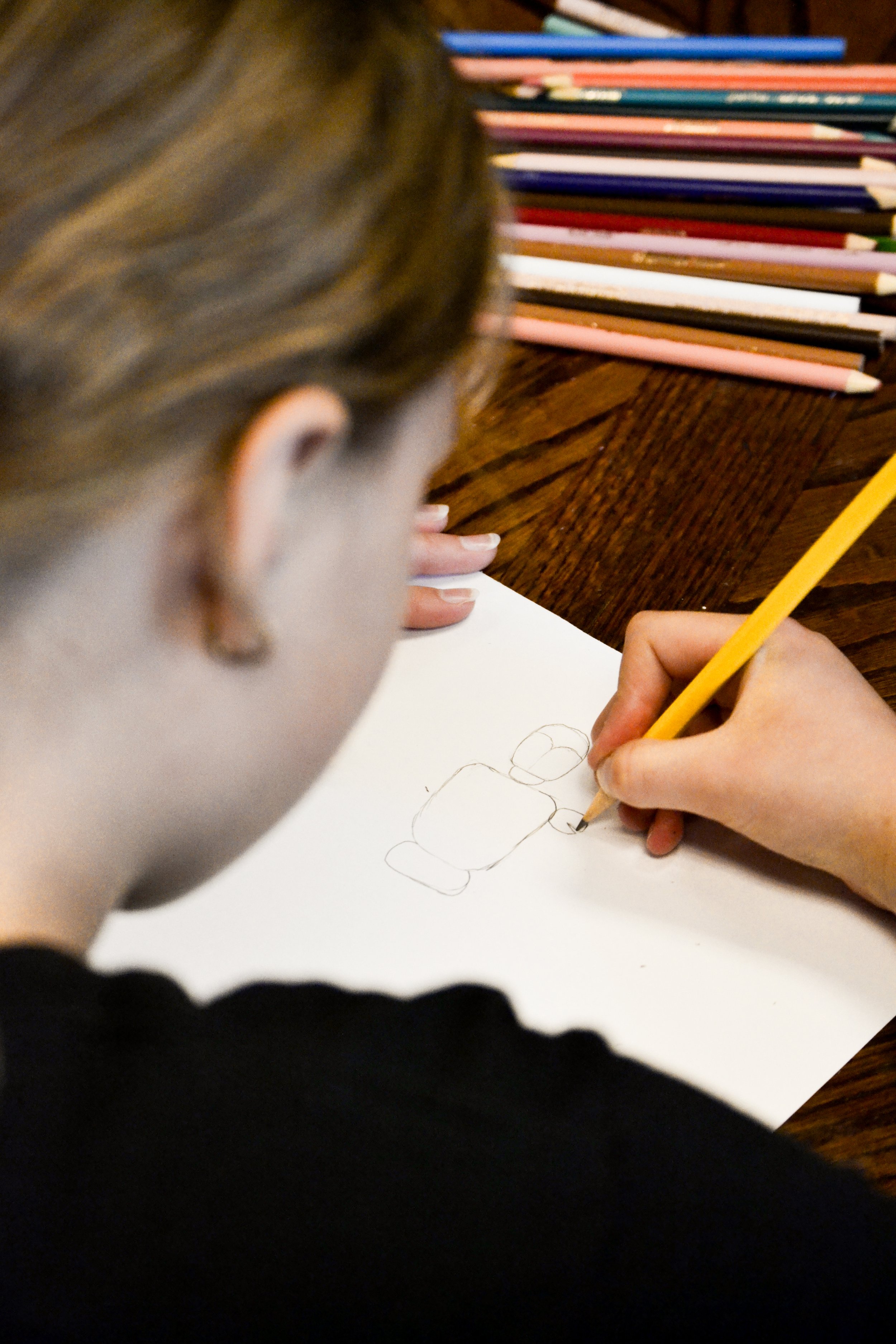 Girl drawing during kids art class in syracuse ut