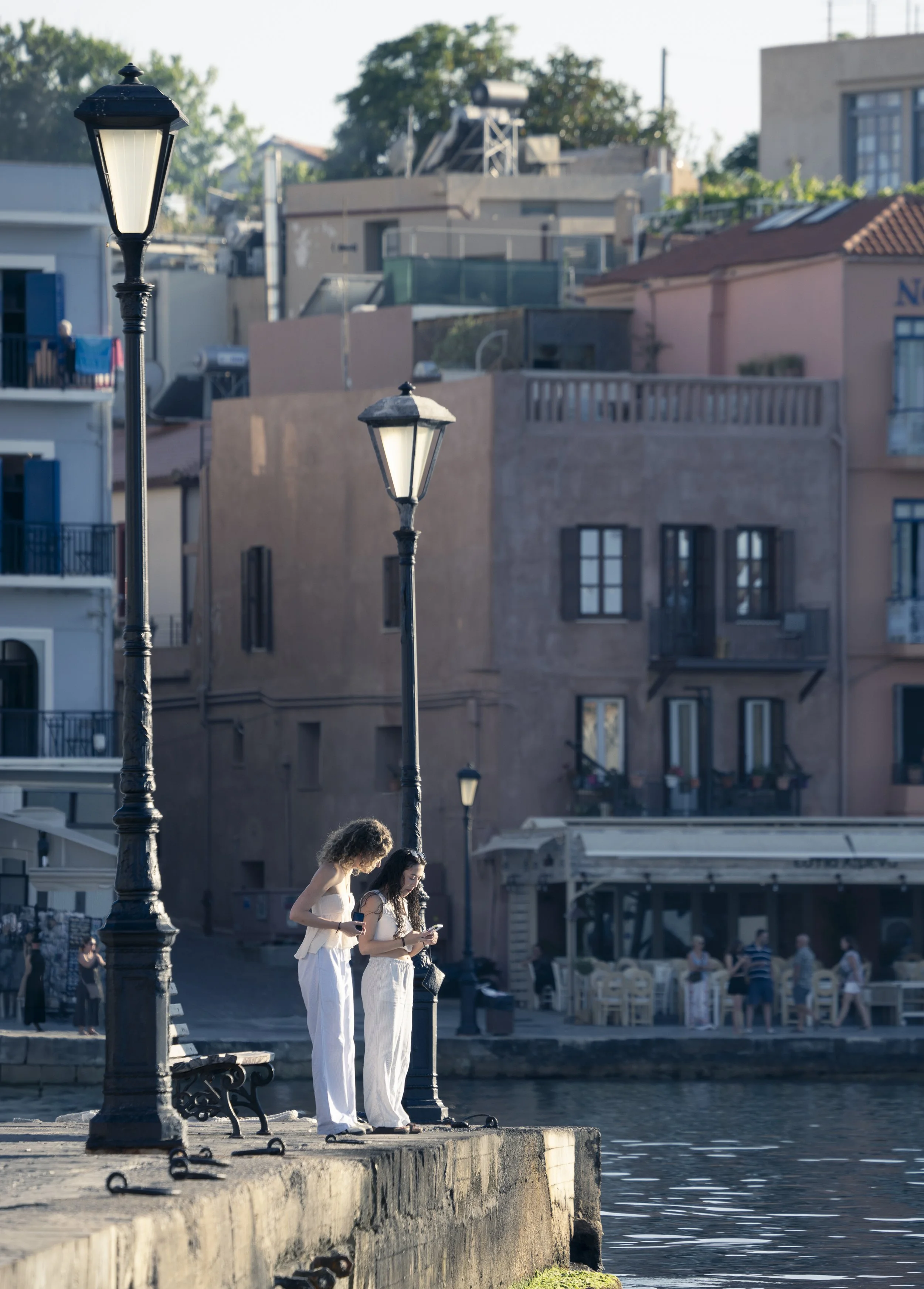 No Instagram selfies or texting - these women were actually taking pictures of the fish in the harbor - Yay! Chania, Crete, Greece