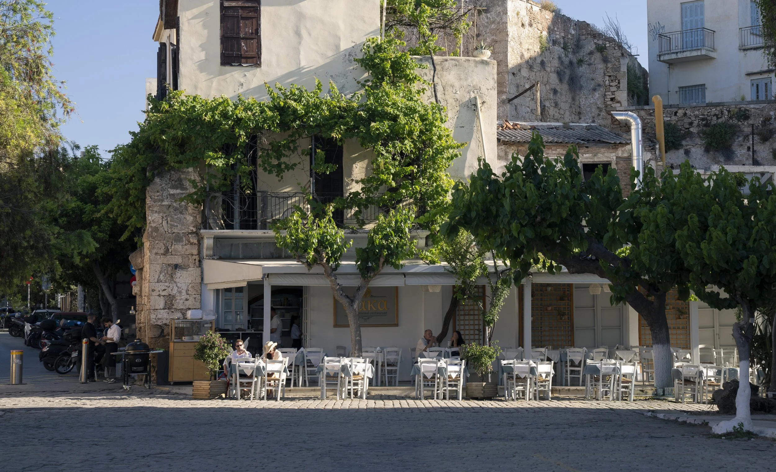 Afternoon restaurant Old Venetian Harbor, Chania, Crete, Greece