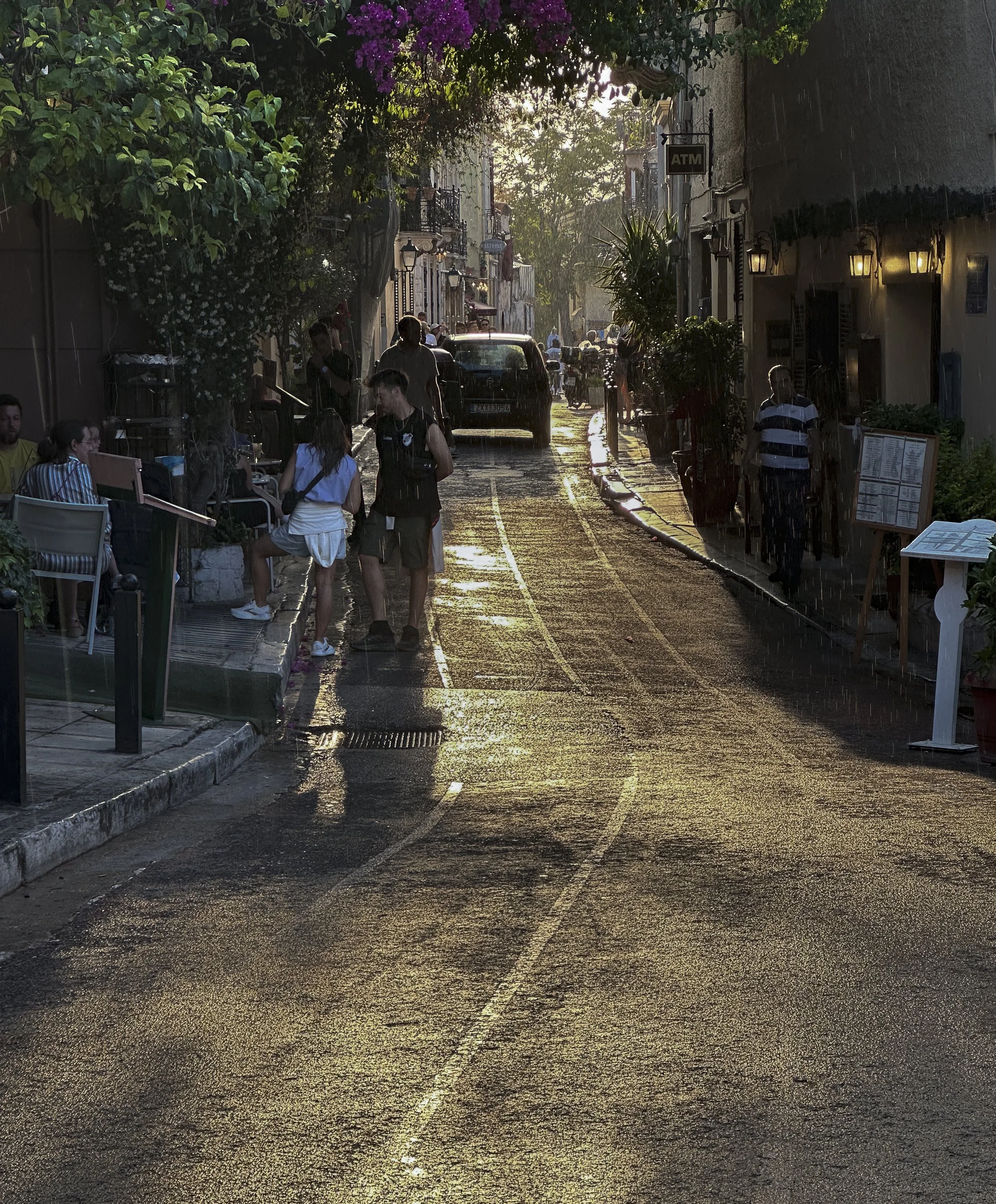 Plaka neighborhood street scene - sunset in the rain - Athens, Greece