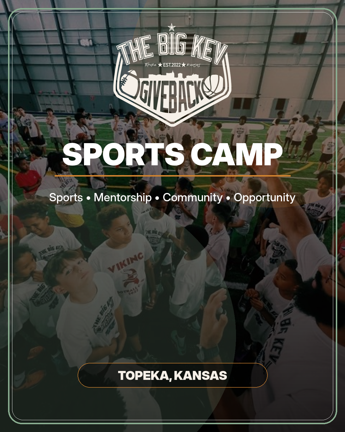 Children and adults gather inside a large indoor football field during a sports camp in Topeka, Kansas. The banner displays 'The Big Key GiveBack Sports Camp' with the words 'Sports, Mentorship, Community, Opportunity' and the location 'Topeka, Kansas'.