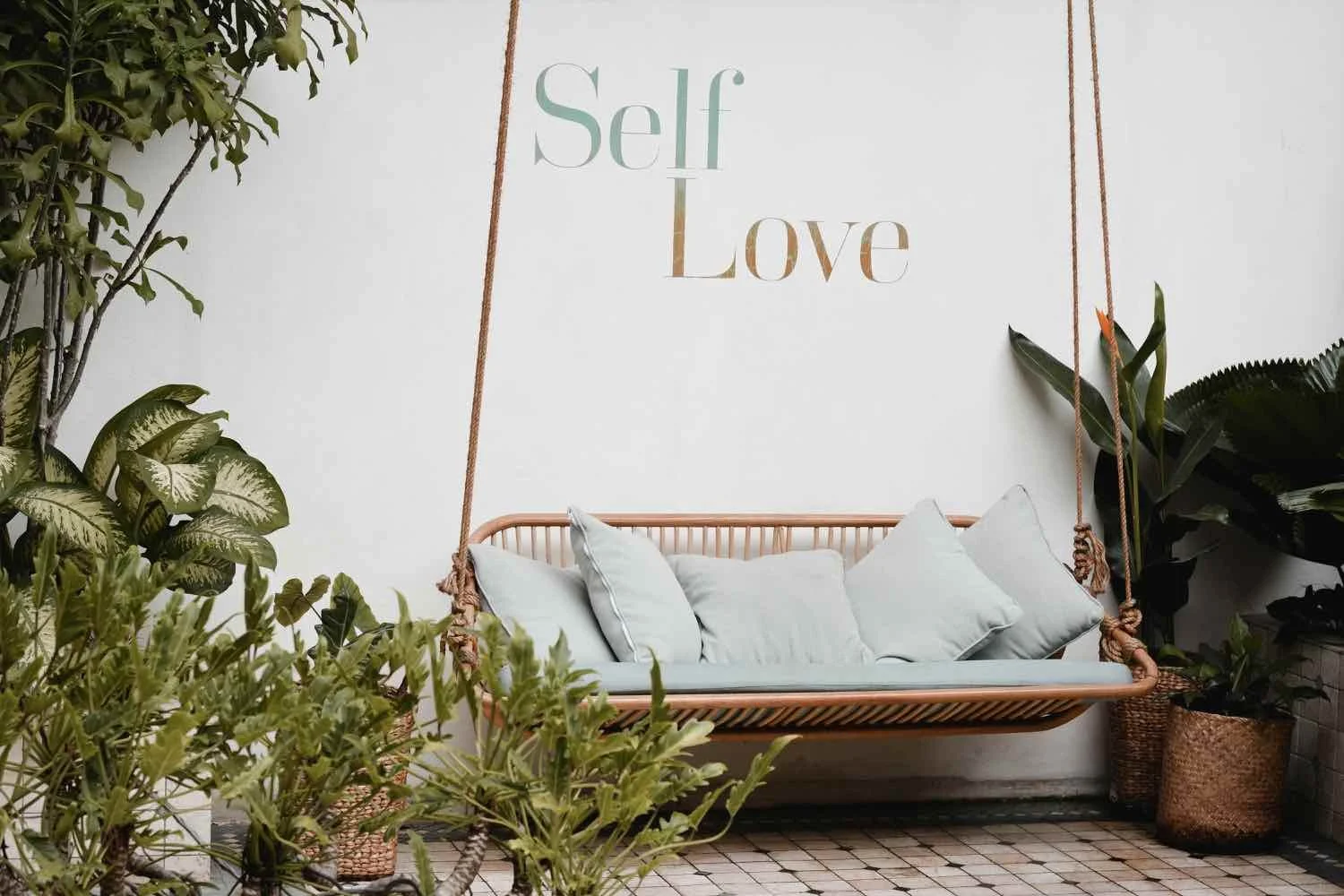 Peaceful garden swing with a “Self Love” sign, symbolizing healing from shame through trauma therapy in Oklahoma City.