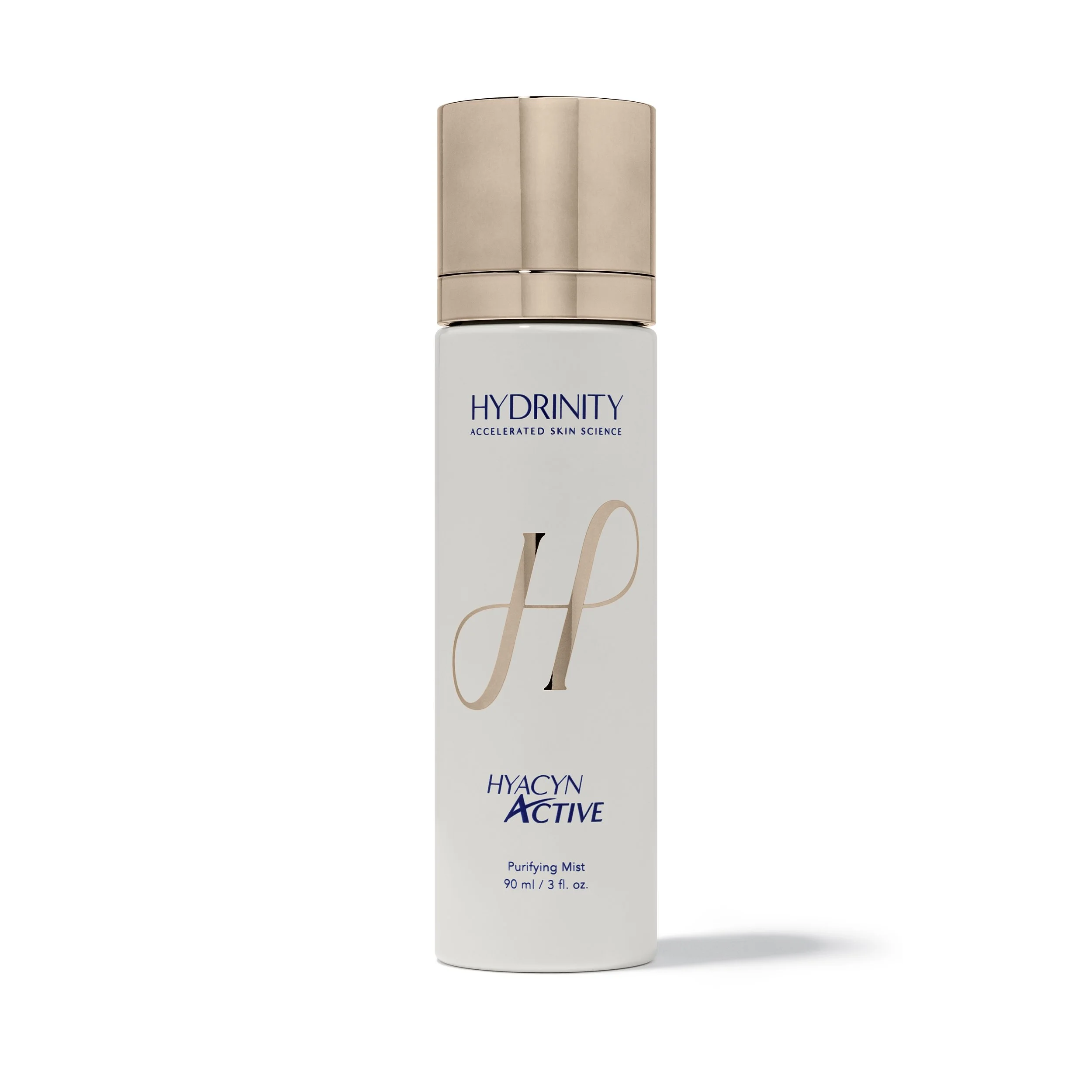 White bottle of Hydrinity Hyacyn Active Purifying Mist with a rose gold cap, featuring pink and blue text and branding.