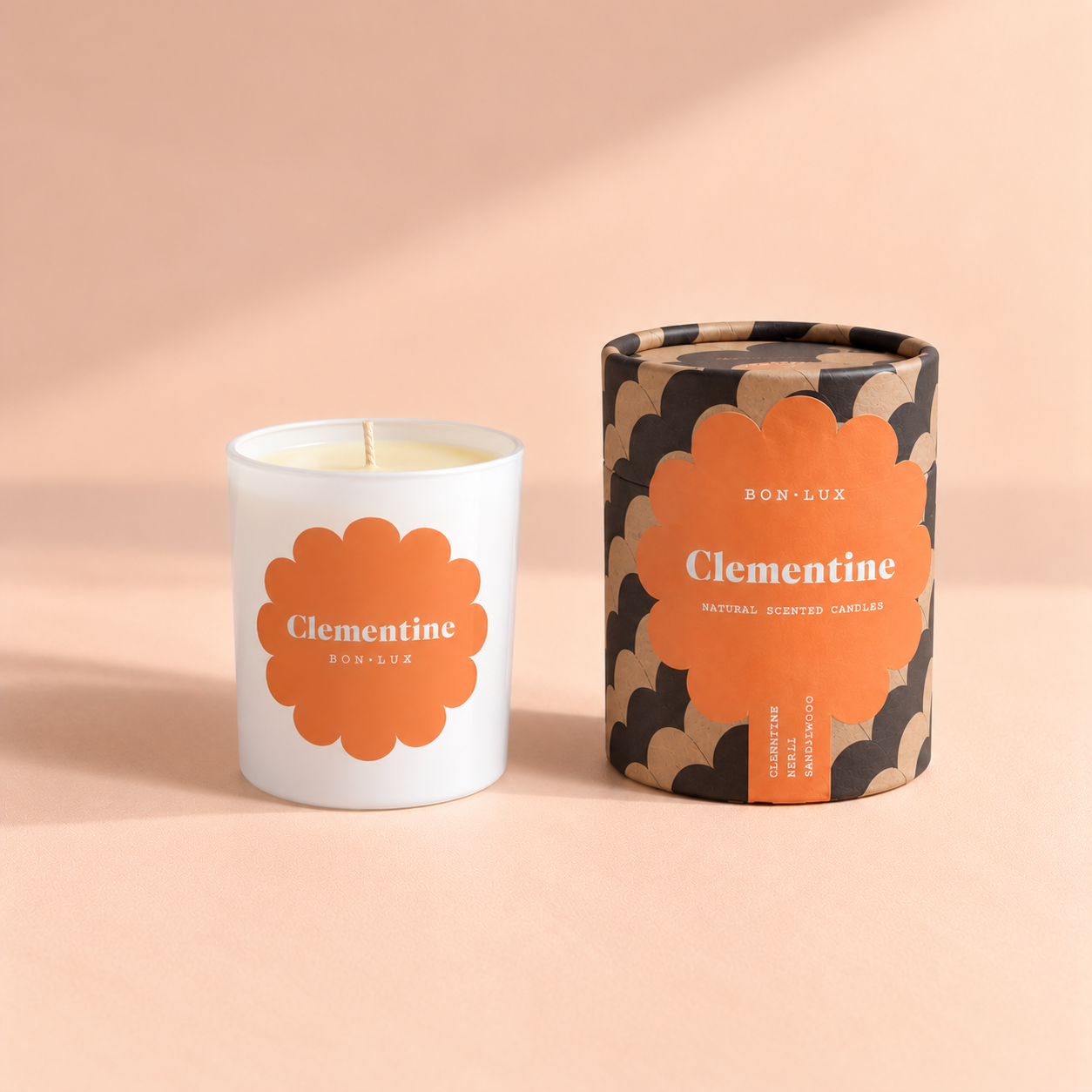 04-clementine-candle-cylindrical-packaging-peach-soft-shadows_cleaned.png