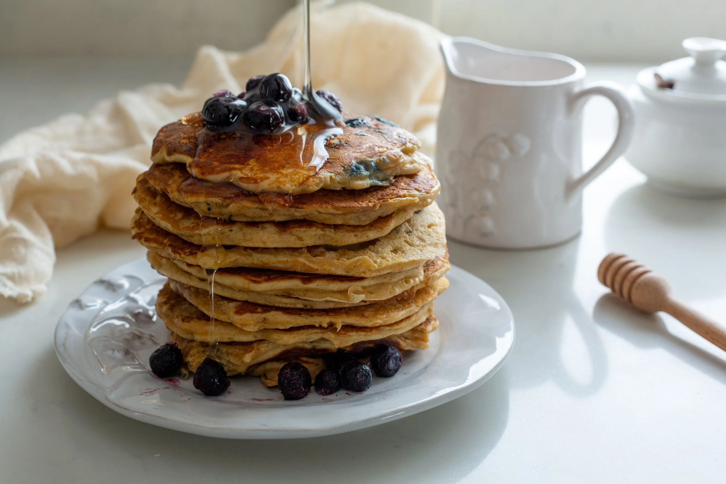 american-style-blueberry-pancakes-drizzled-in-maple-syrup.jpg