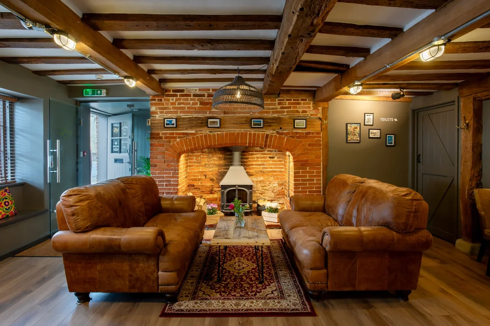 Comfortable leather sofas at The Lion's Den Cafe Midhurst | Cafe photography by Sequoia Studios