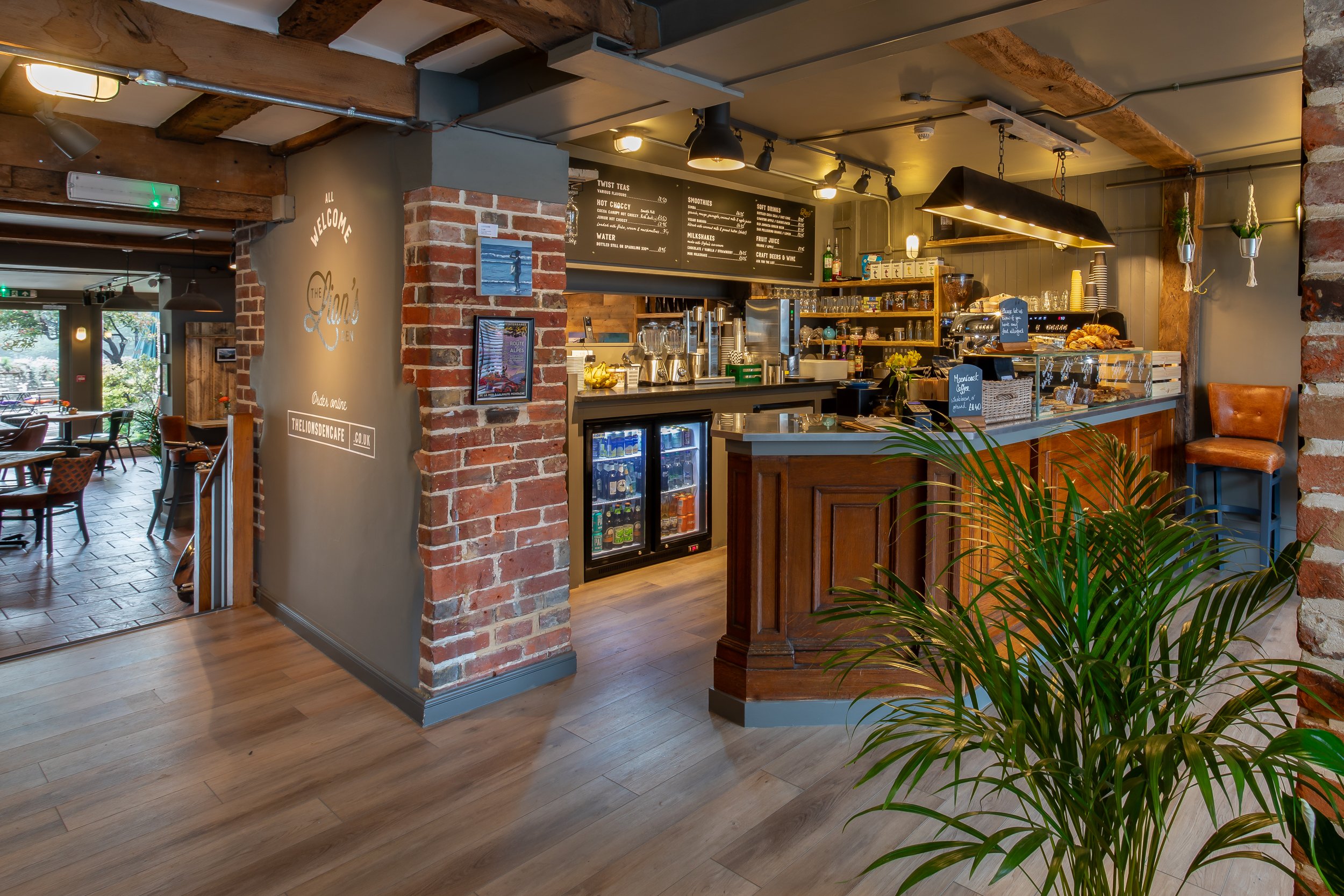 Café counter and wide shot along length of premises – The Lion's Den Midhurst – Hospitality Venue Photography by Sequoia Studios