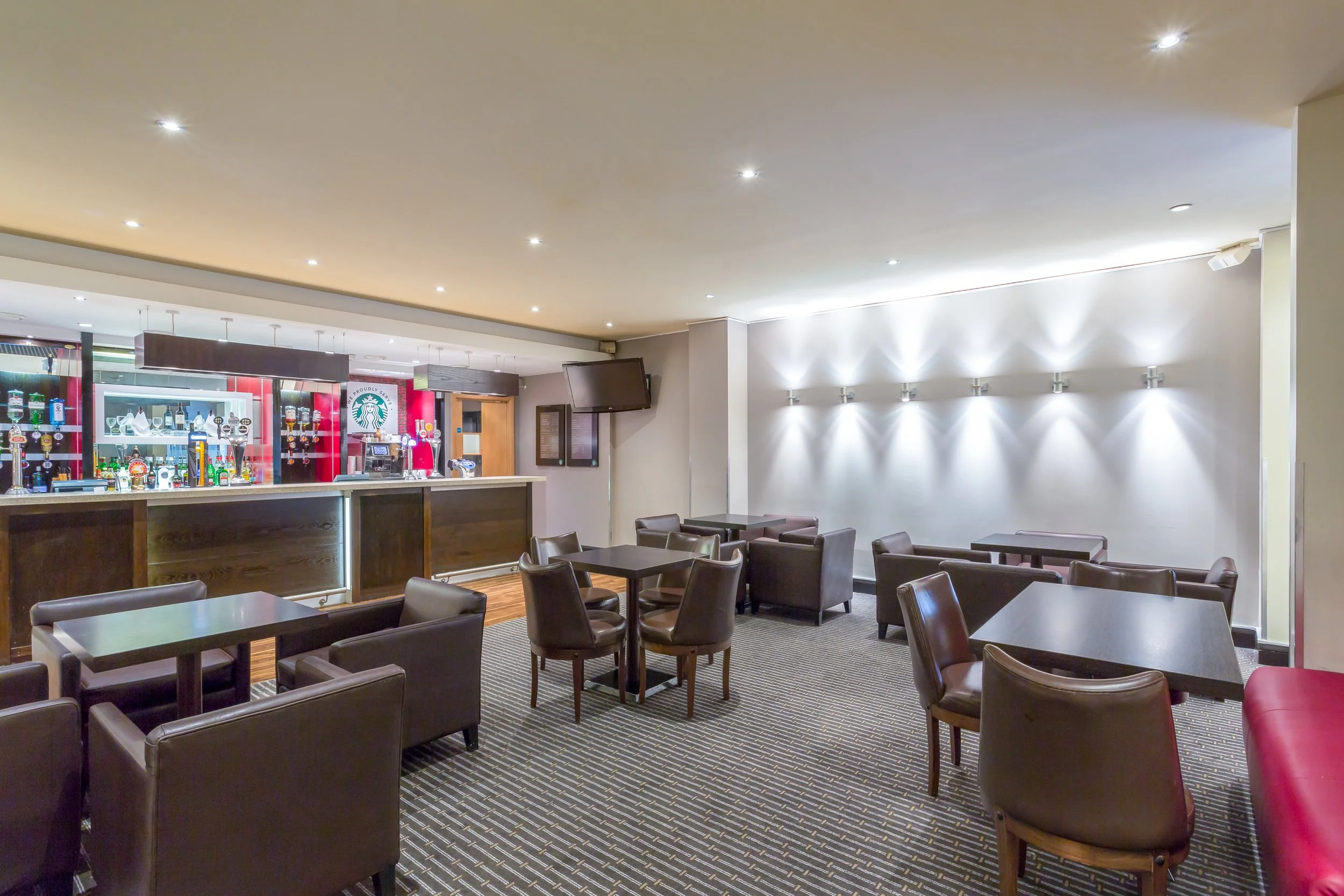 Wide shot of hotel bar and seating area at Holiday Inn, Cambridge