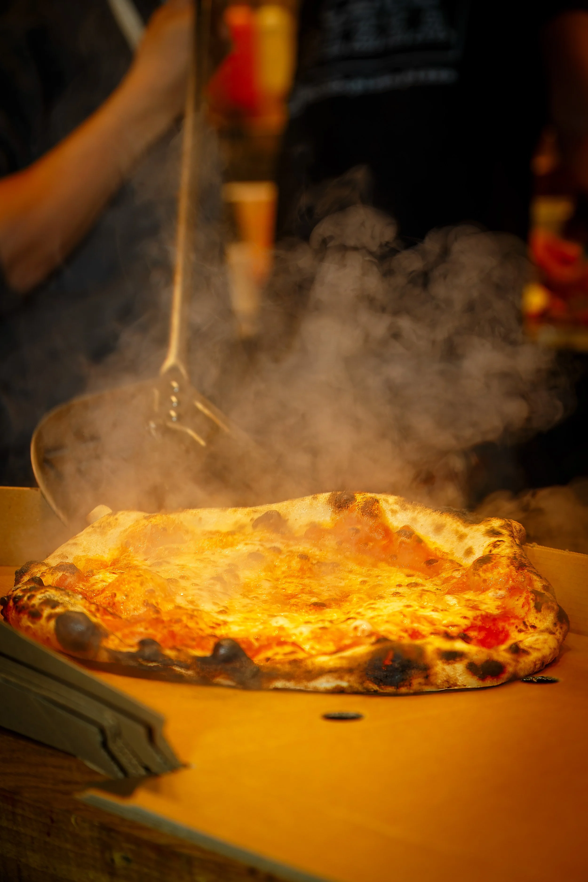 Smoking hot pizza straight from wood-fired oven at Club Pizza