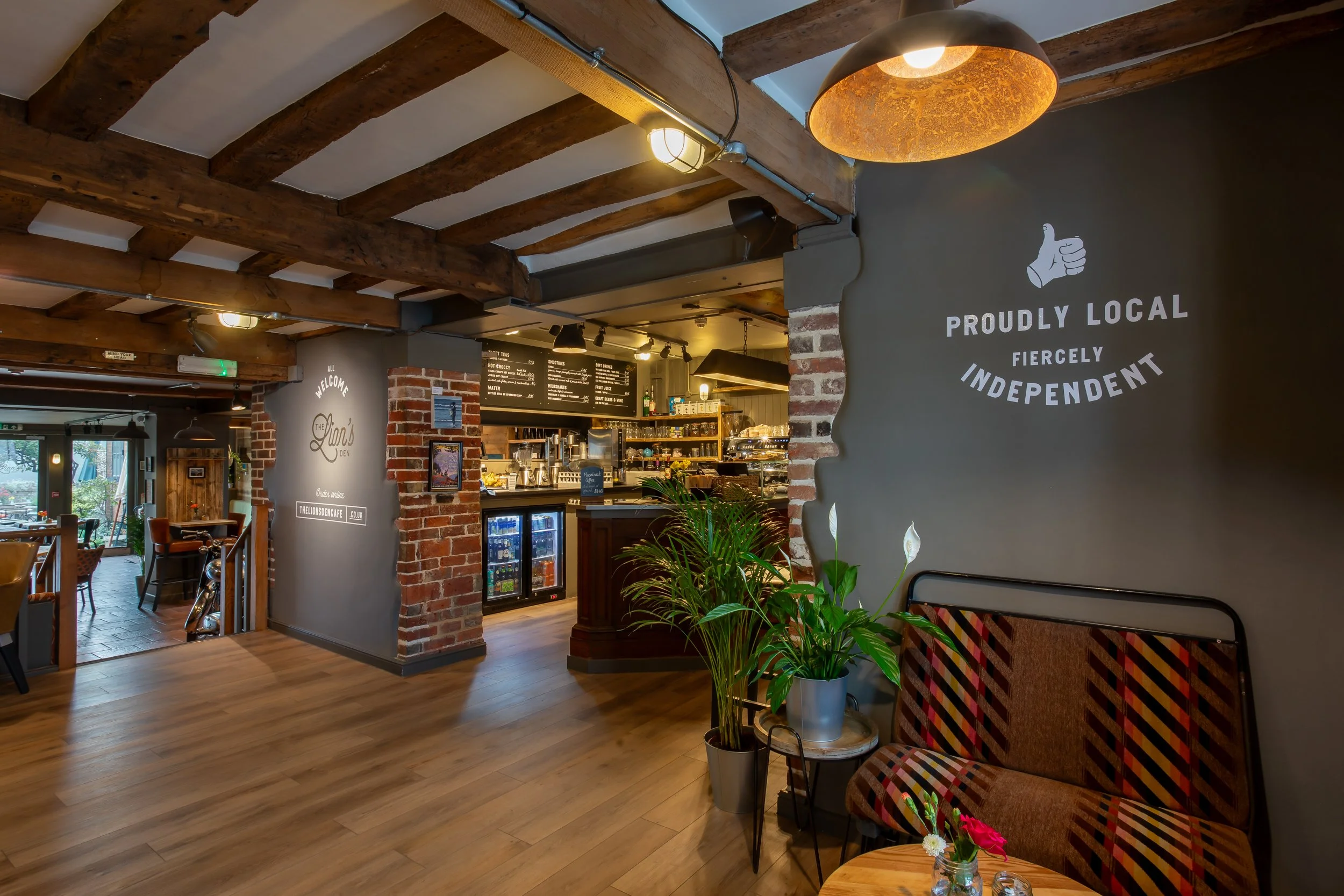 Wide shot of café counter and signage – The Lion's Den Midhurst – Hospitality Venue Photography by Sequoia Studios
