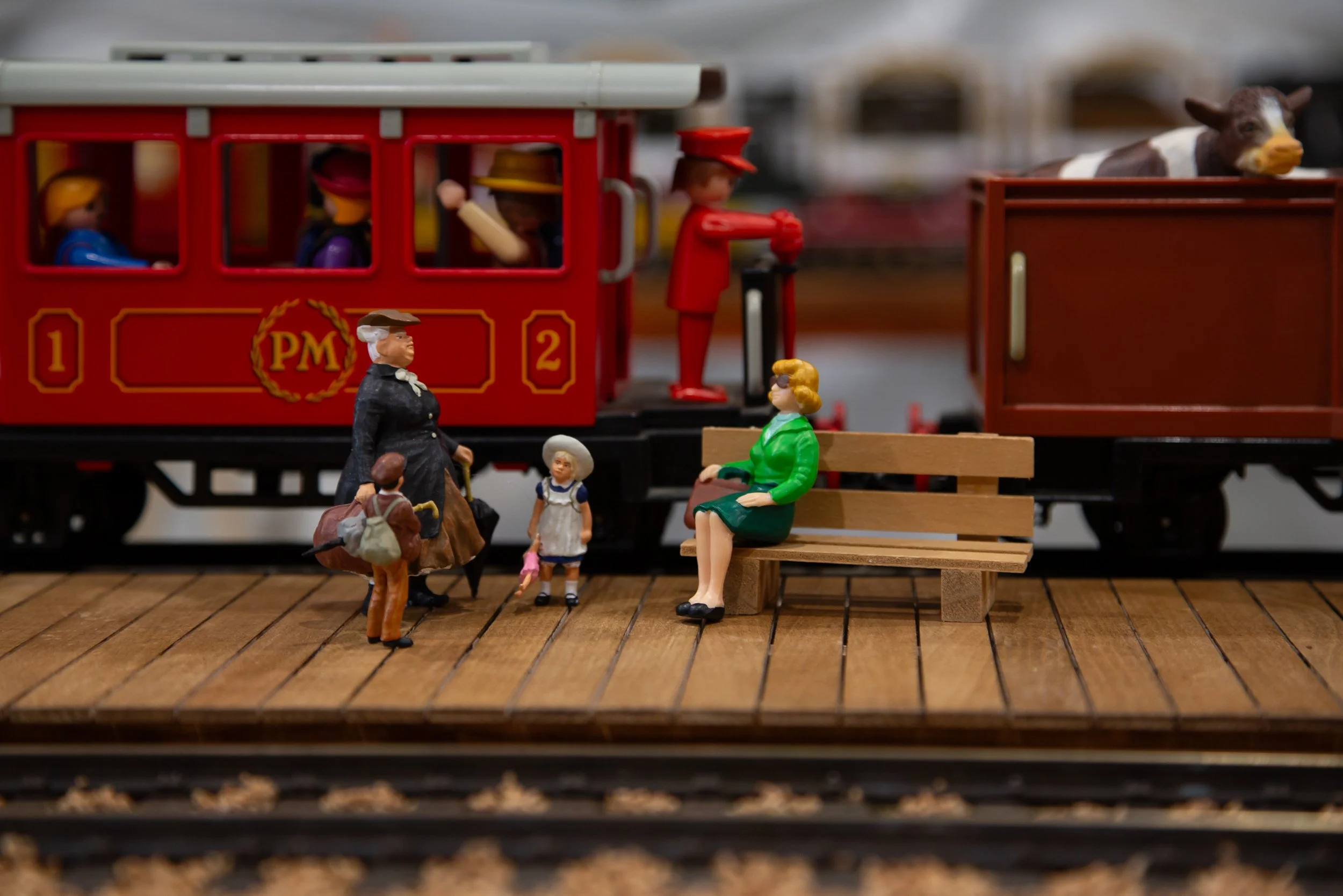 Model passengers at model train station – Hollycombe Mega Model Weekend – Event Photography by Sequoia Studios