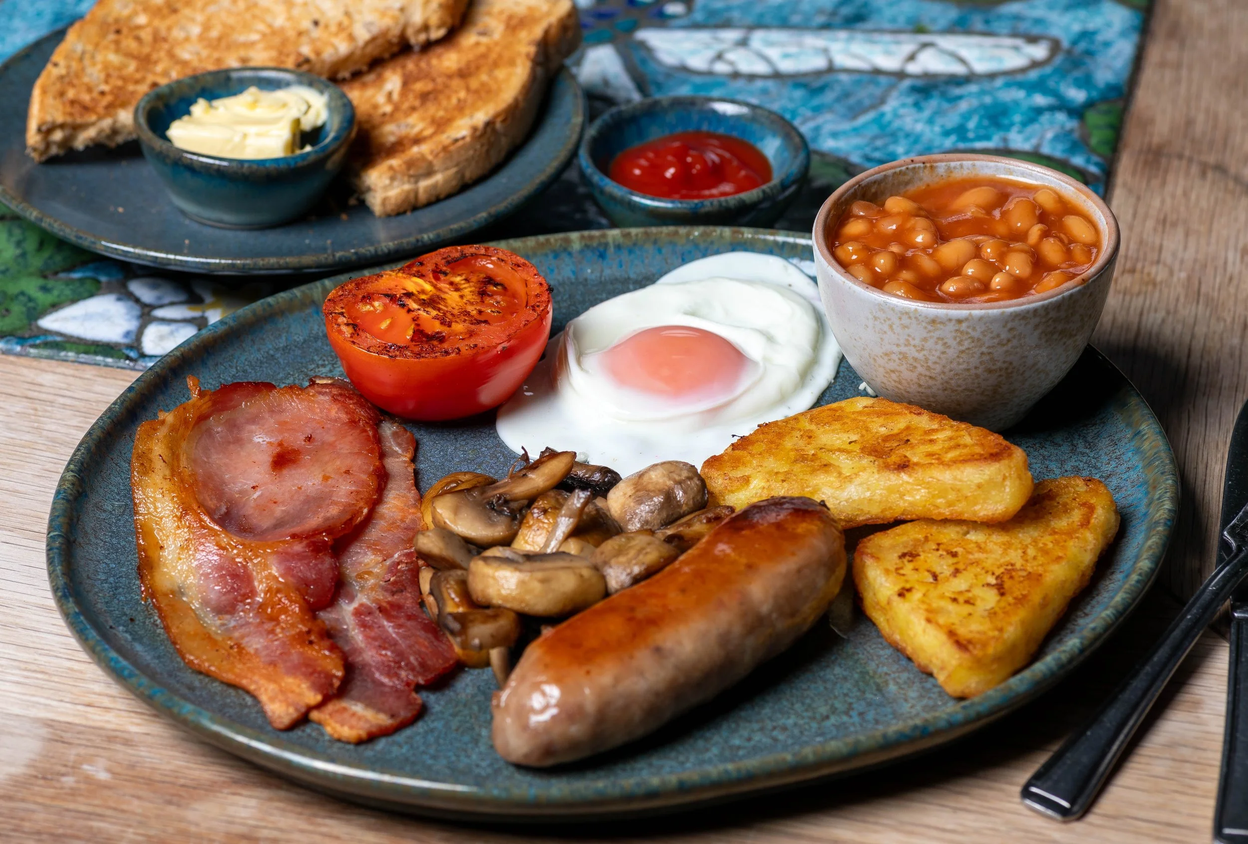 Full English breakfast served at The Kiln Cafe on crockery made at Grayshott Pottery