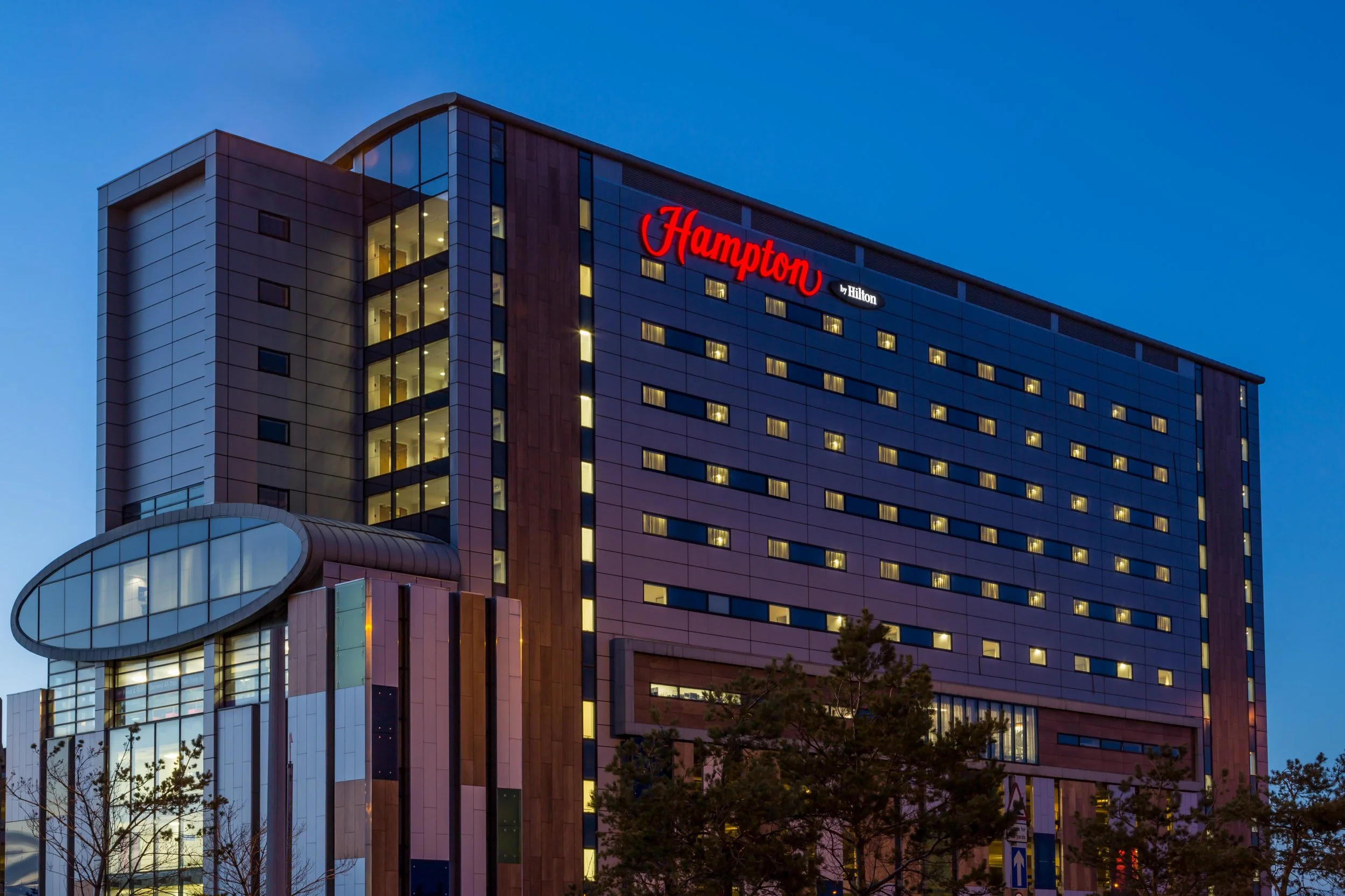 Evening exterior of Hampton by Hilton hotel in Liverpool