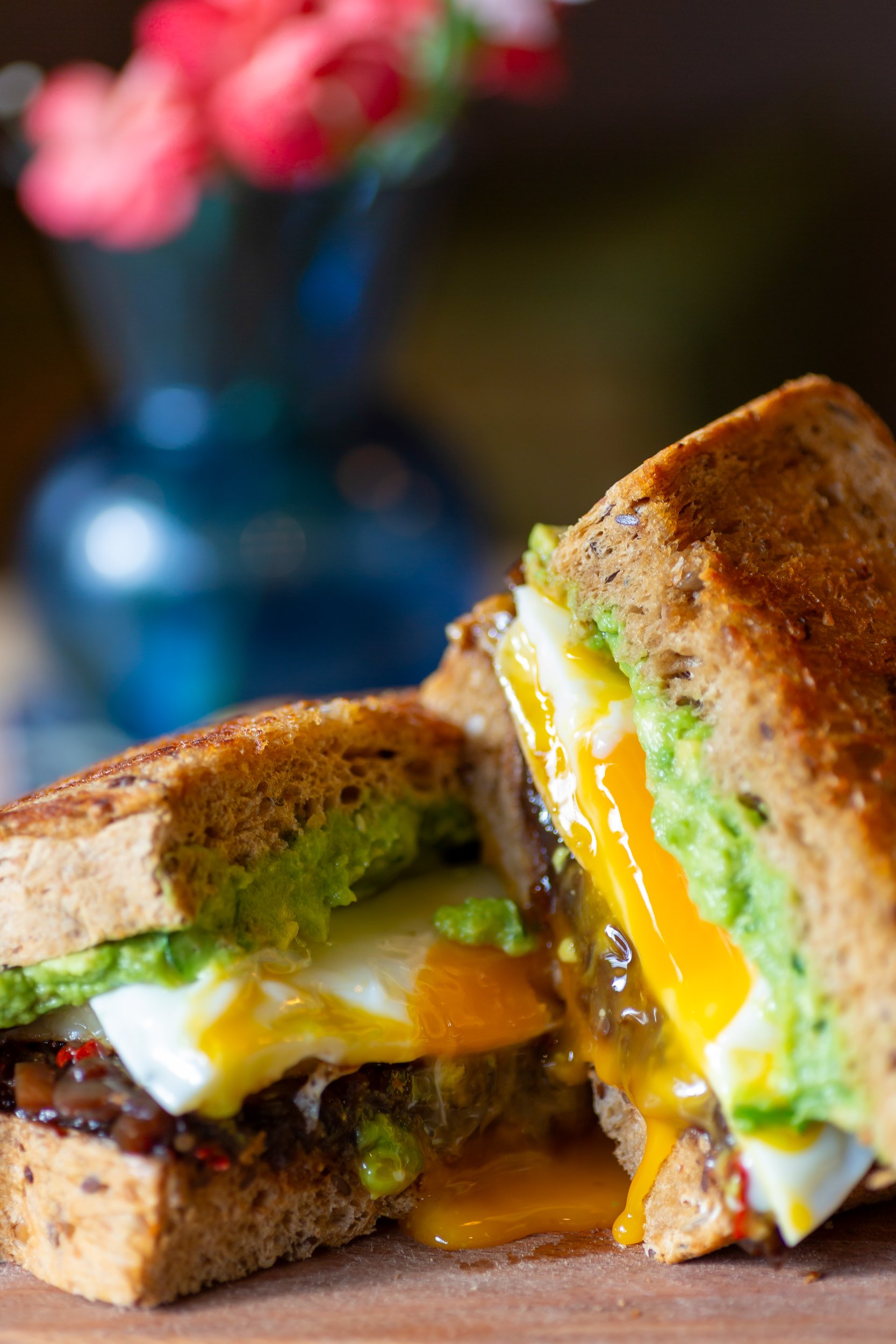 Egg yolk runs out of the Dirty Den breakfast sandwich  – The Lion's Den Café, Haslemere, Surrey – Food Photography by Sequoia Studios