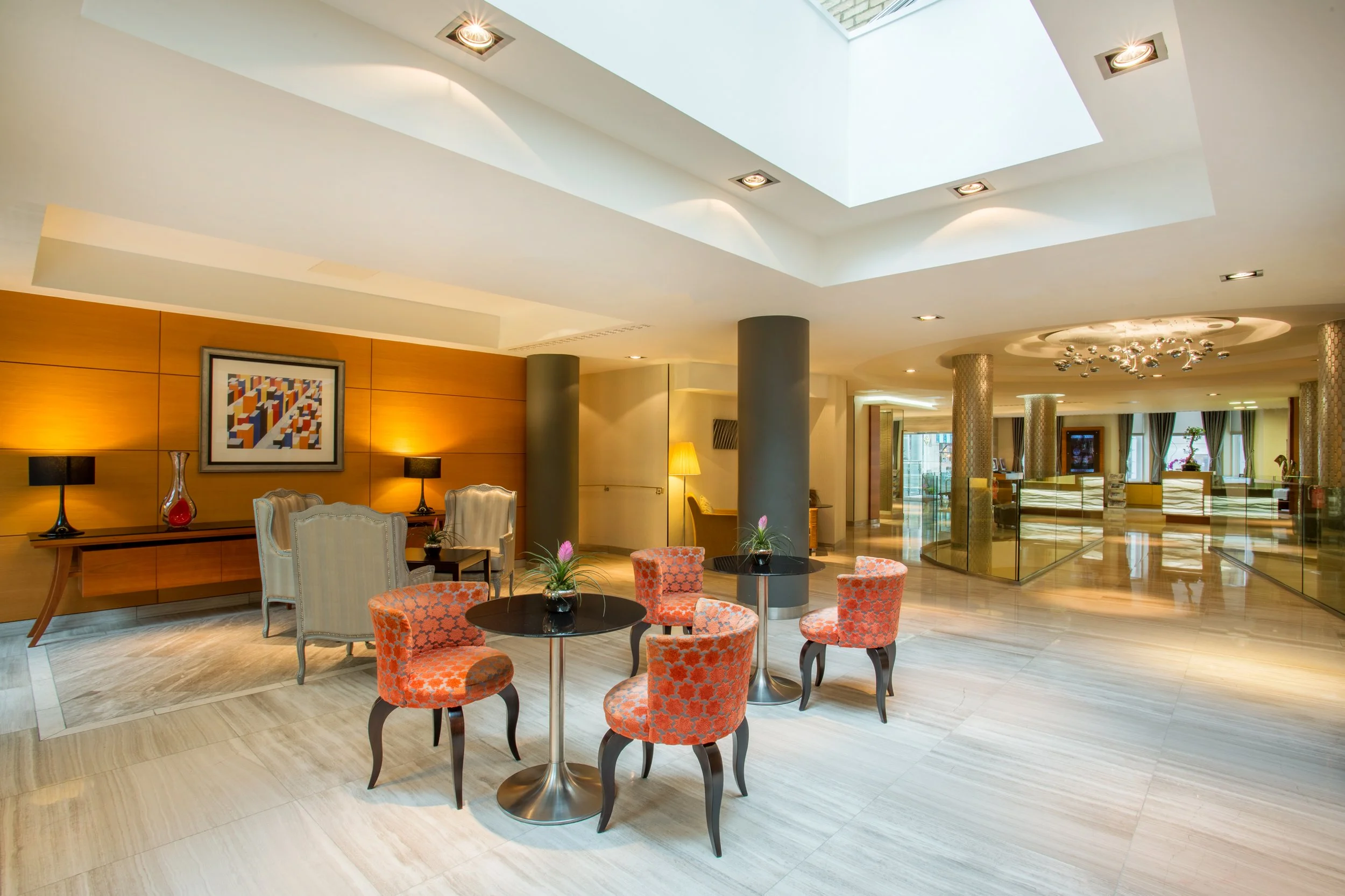 Elegant lobby seating with garden view at Crowne Plaza hotel in Kensington, London