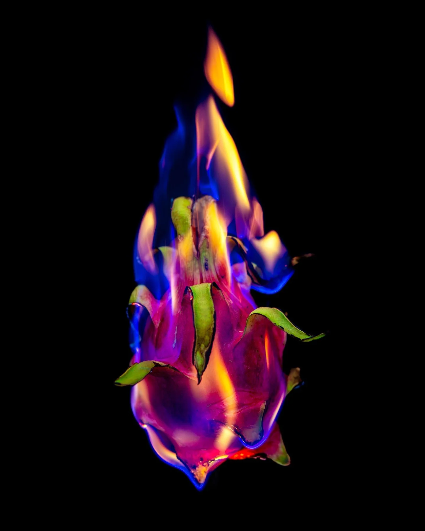 Playing with fire.
Playing with food.
Playing with perception.

Dragon fruit, which is already otherworldly, becomes something elemental when flame meets skin.

Fine art food photography allows ingredients to become symbols.
Texture becomes sculpture