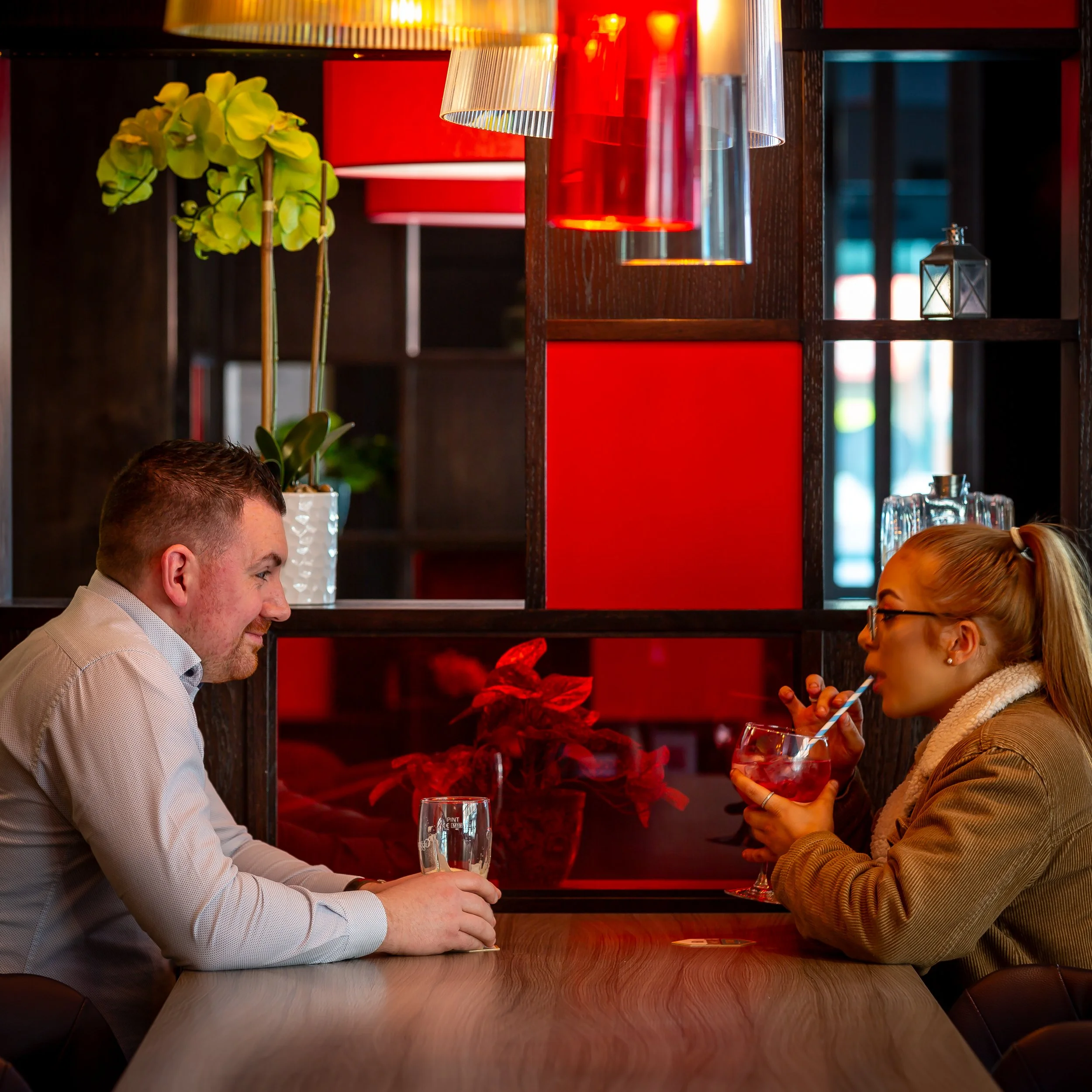 couple-enjoying-drinks-hotel-bar.jpg