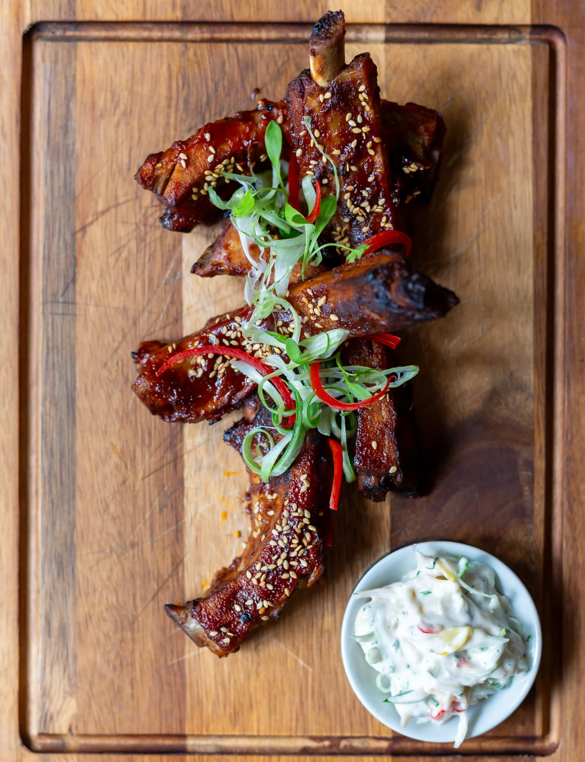 Overhead photo of Korean-style pork ribs at The Wheatsheaf Inn Grayswood, Surrey – Food Photography by Sequoia Studios