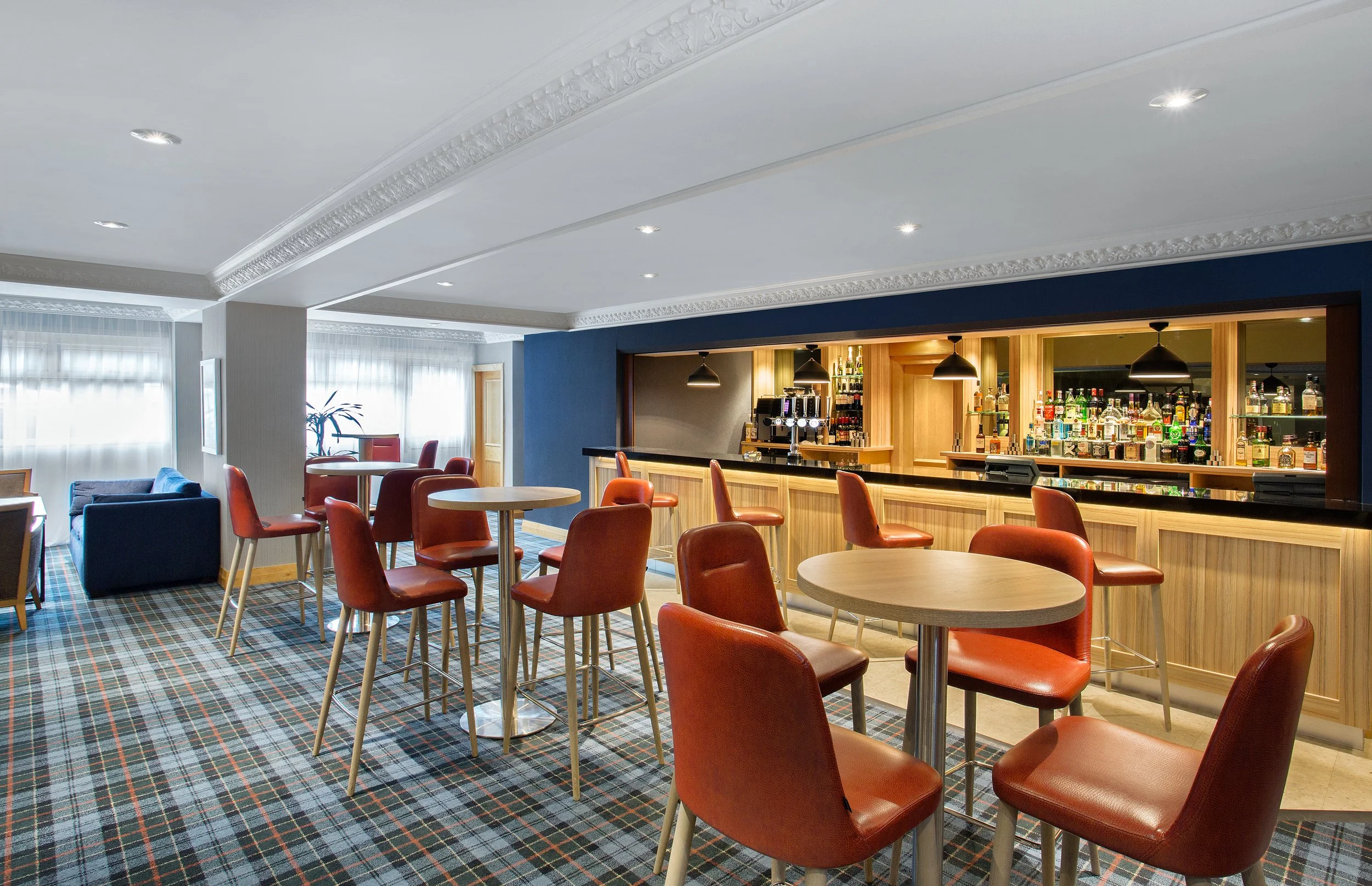 Wide shot of hotel bar and lounge seating at Jurys Inn, Inverness, Scotland