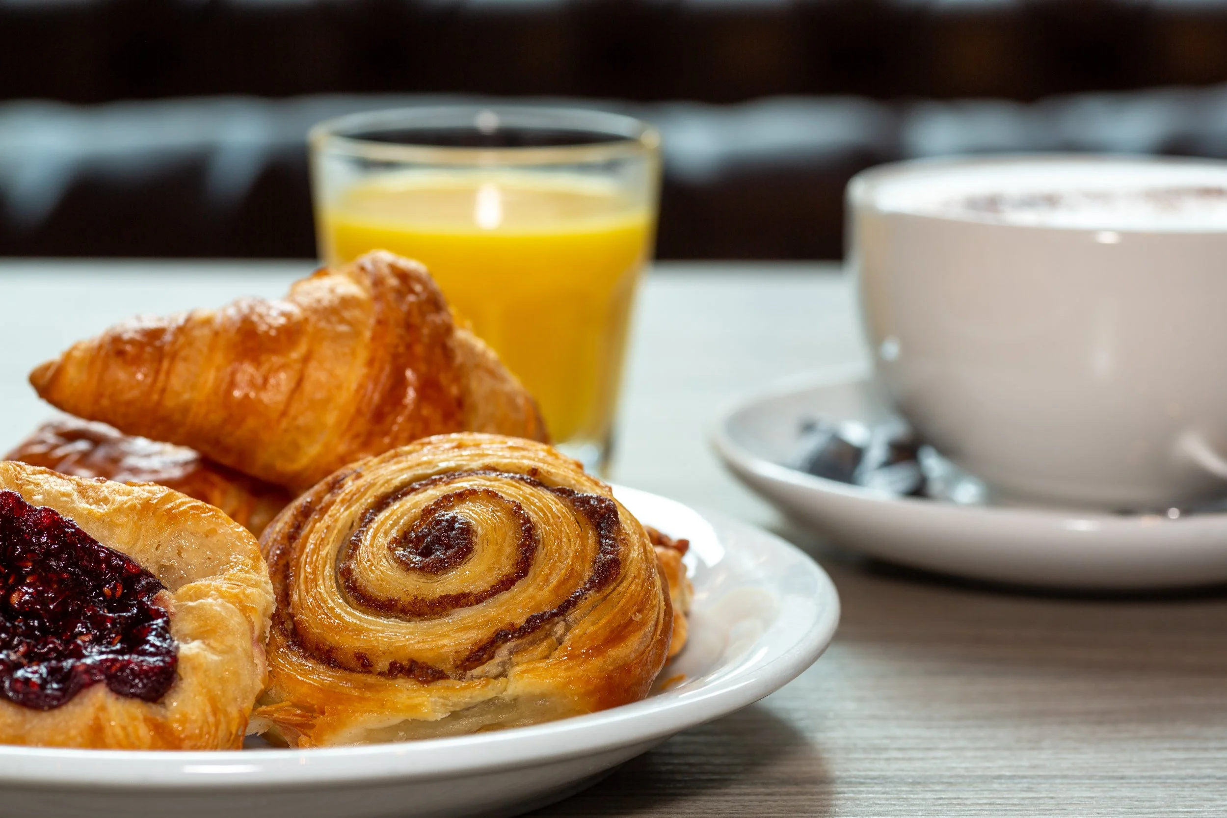 IBIS Hotels Belfast – breakfast pastries with coffee and orange juice – Hotel Photography by Sequoia Studios