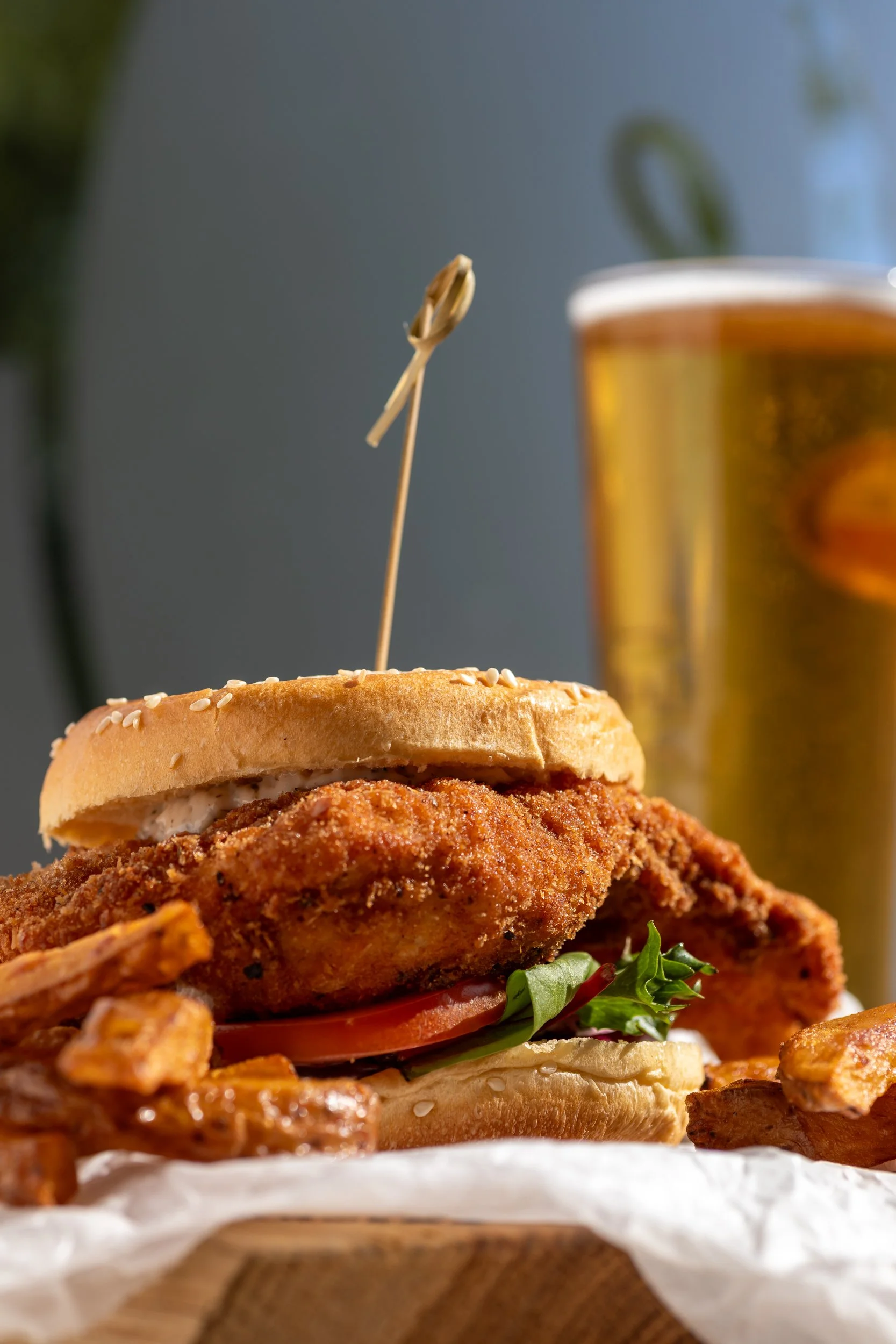 Chicken burger with ice cold lager at The Folly Wine Bar in Petersfield, Hampshire. Food photography by Sequoia Studios.