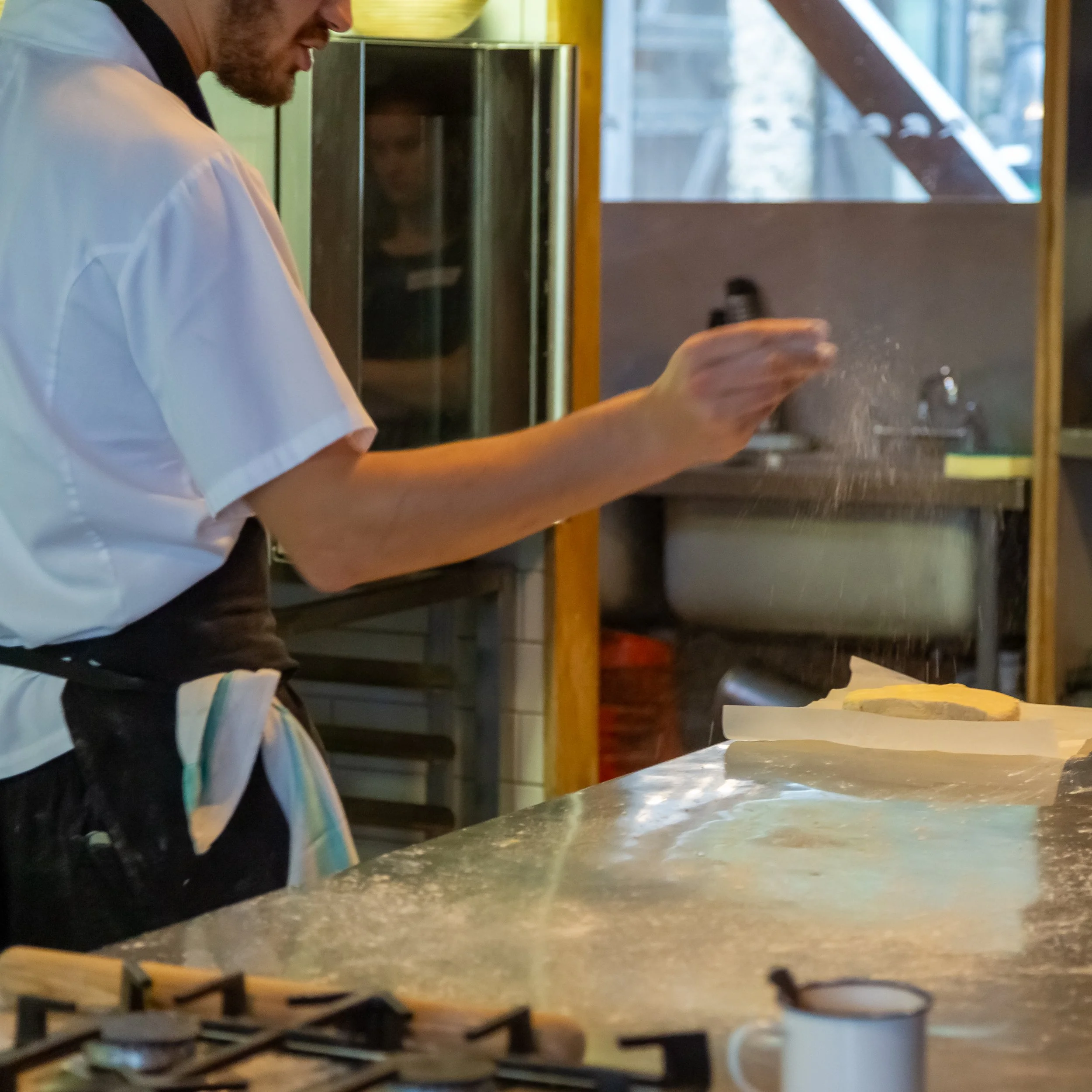 cookery-school-chef-dusts-counter-with-flour-river-cottage-axminster.jpg