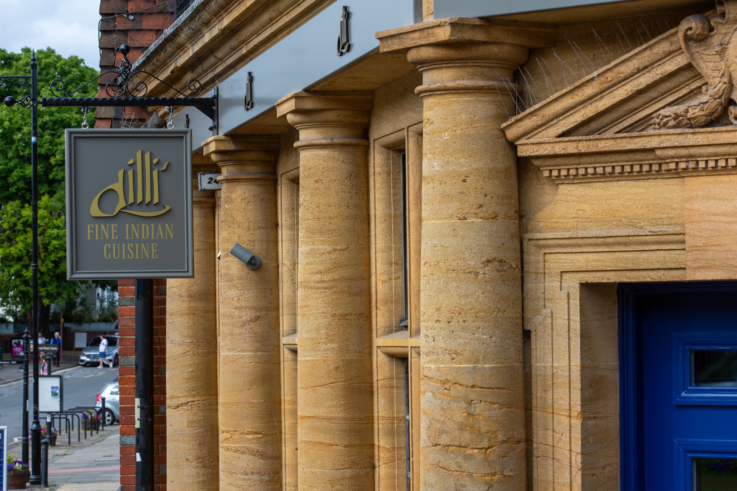 Signage of The Dilli restaurant, serving fine Indian cuisine in Haslemere, Surrey